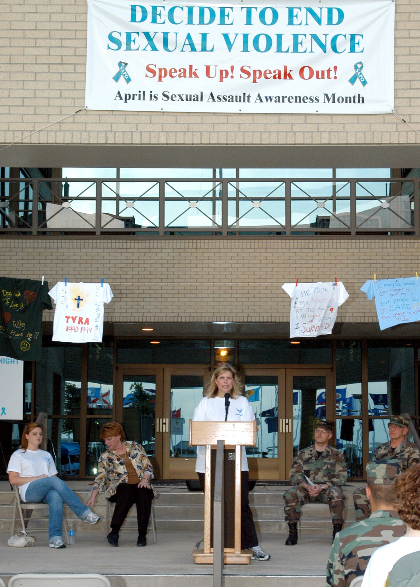 Dr. Charlotte Moerbe speaks during the "Take Back the Night" march at Lackland Air Force Base, Texas, on Wednesday, April 5, 2006. She is the director of the Sexual Assault Prevention and Outreach Office at Lackland. (U.S. Air Force photo/Alan Boedeker)