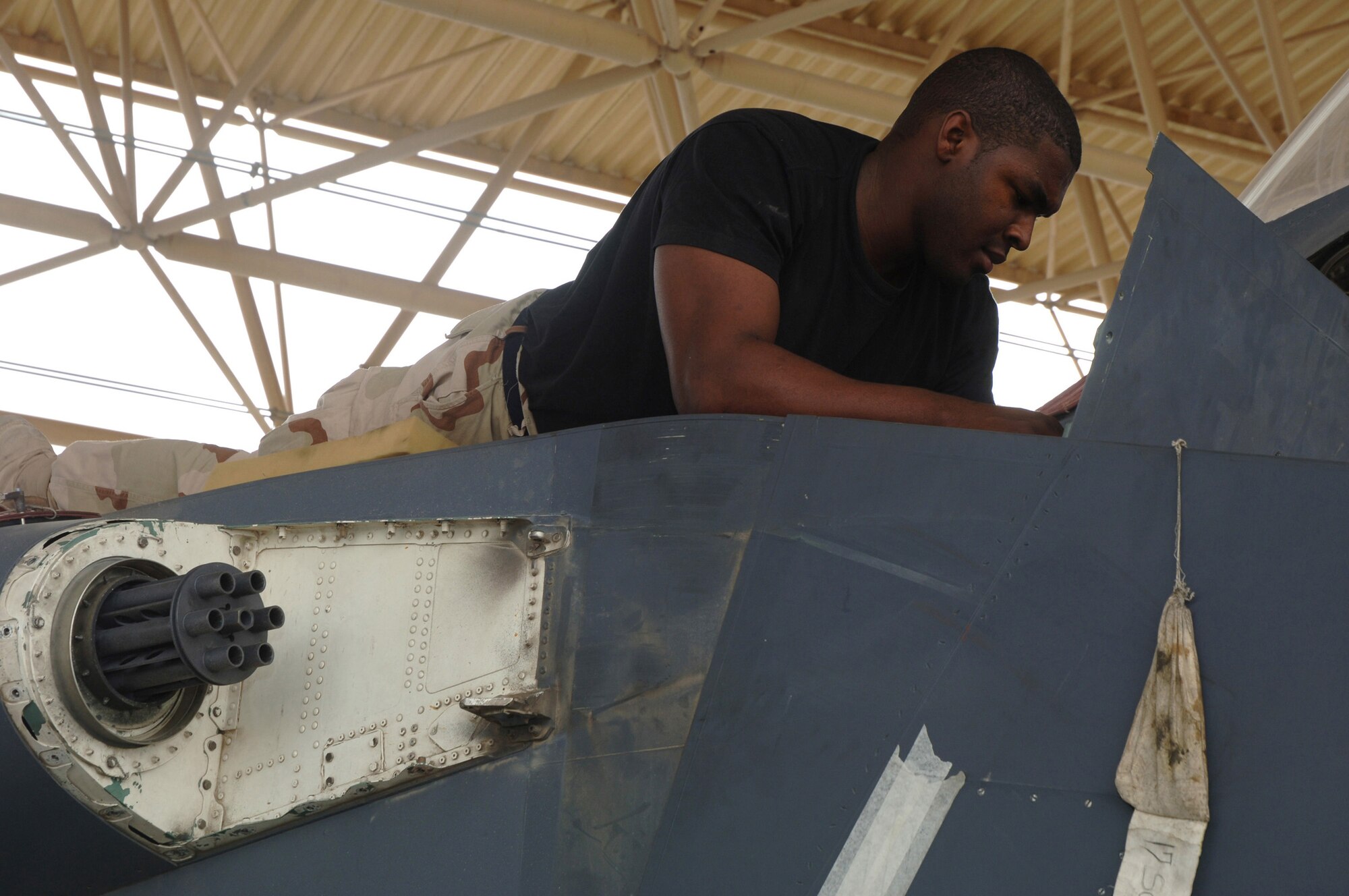 An Airman with the 379th Expeditionary Aircraft Maintenance Squadron inspects an F-15E Strike Eagle at a forward-deployed location in Southwest Asia, on Wednesday, April 5, 2006.  The F-15E is a dual-role fighter designed to perform air-to-air and air-to-ground missions. It is deployed from Seymour Johnson Air Force Base, N.C. (U.S. Air Force photo/Staff Sgt. Joshua Strang)