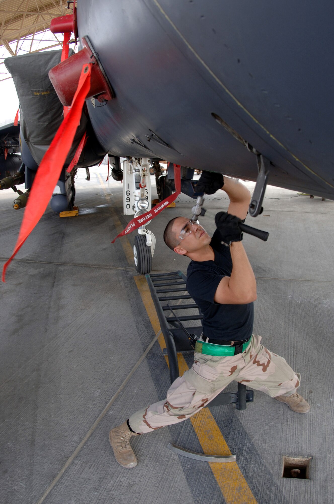An Airman with the 379th Expeditionary Maintenance Squadron works on an F-15E Strike Eagle at a forward-deployed location in Southwest Asia, on Wednesday, April 5, 2006.  The F-15E is a dual-role fighter designed to perform air-to-air and air-to-ground missions. It is deployed from Seymour Johnson Air Force Base, N.C. (U.S. Air Force photo/Staff Sgt. Joshua Strang)