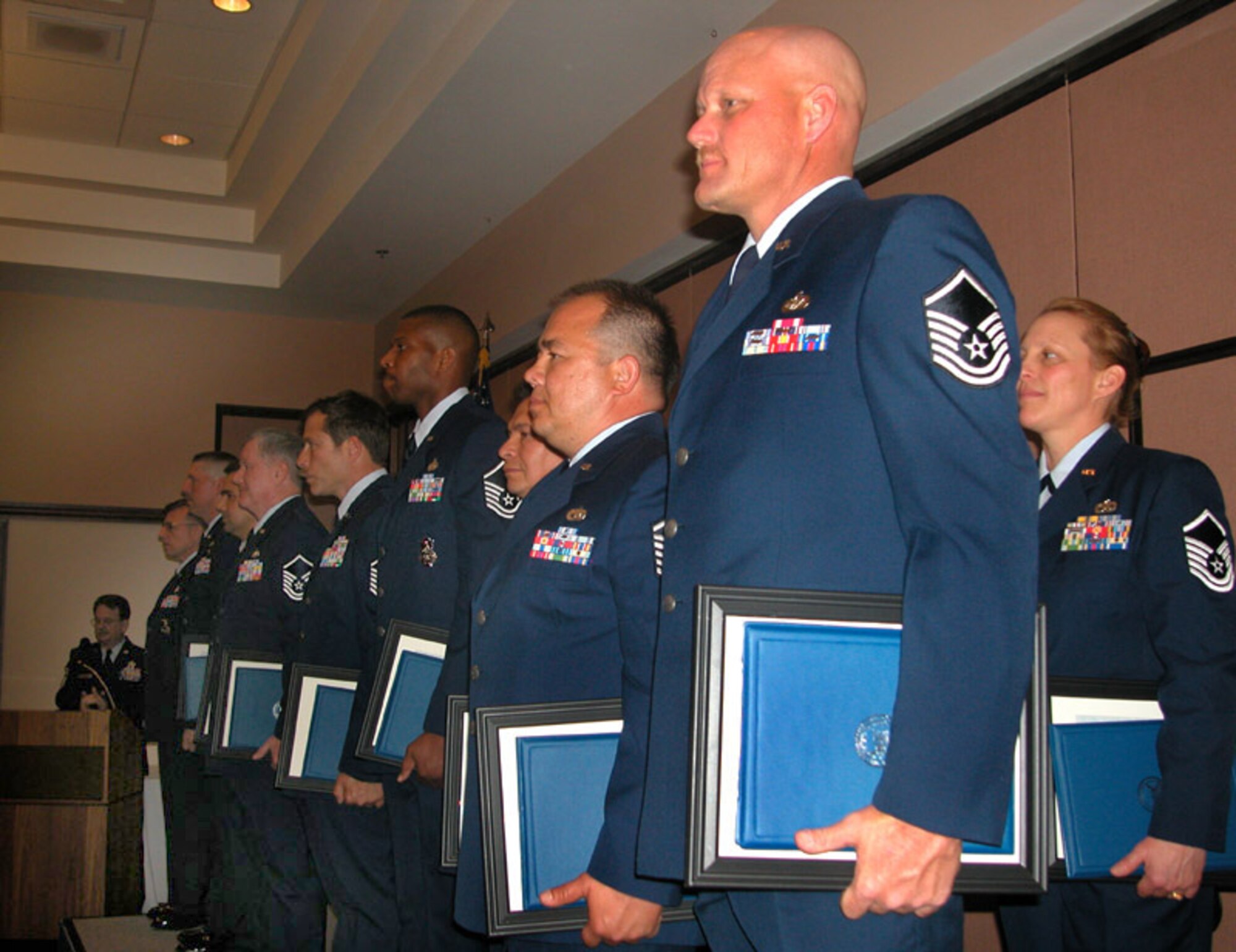 04/02/06 - BEALE AIR FORCE BASE, Calif. -- Air Force Reservists from the 940th Air Refueling Wing stand at attention during a top three induction ceremony held April 2 at Recce Point bas club.. The event renforces the leadership role the wing's newest master sergeants assime upon promotion. (U.S. Air Force photo/Tech. Sgt. Brynna Bryant)