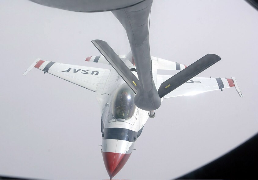 GRAND FORKS AFB, N.D. - A KC-135 Stratotanker from the 319th Air Refueling Wing at Grand Forks Air Force Base. N.D., refuels an F-16 Falcon of the U.S. Air Force's Aerial Demonstration Squadron, the Thunderbirds, April 3.  (U.S. Air Force Photo by Airman 1st Class Chad Kellum, 319th Communications Squadron)