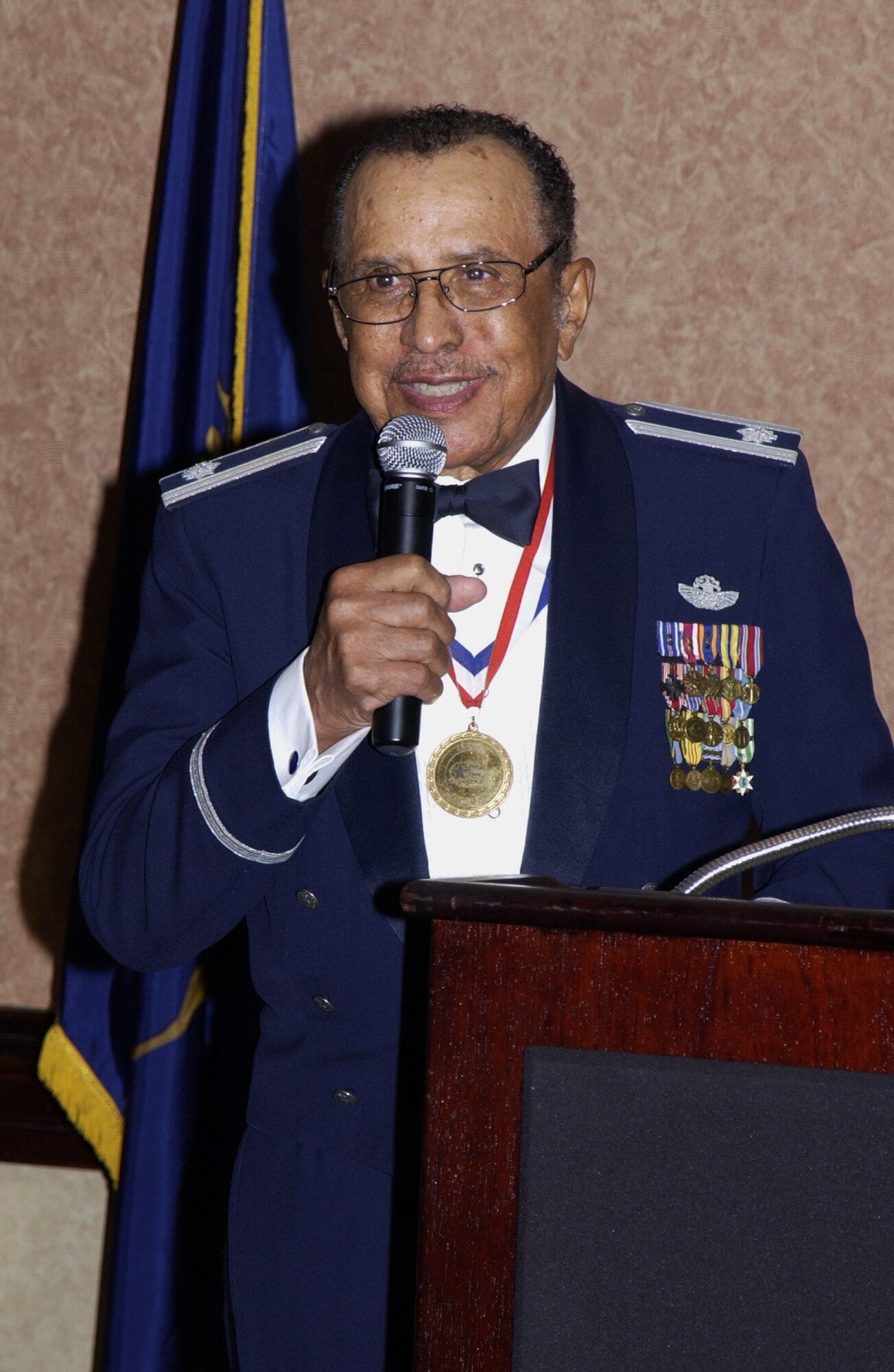 Retired Lt. Col. James Warren, one of the original Tuskegee Airmen, speaks to the Sgt Paul P. Ramoneda Airman Leadership School graduates March 23. (U.S. Air Force photo by Arielle Kohn)