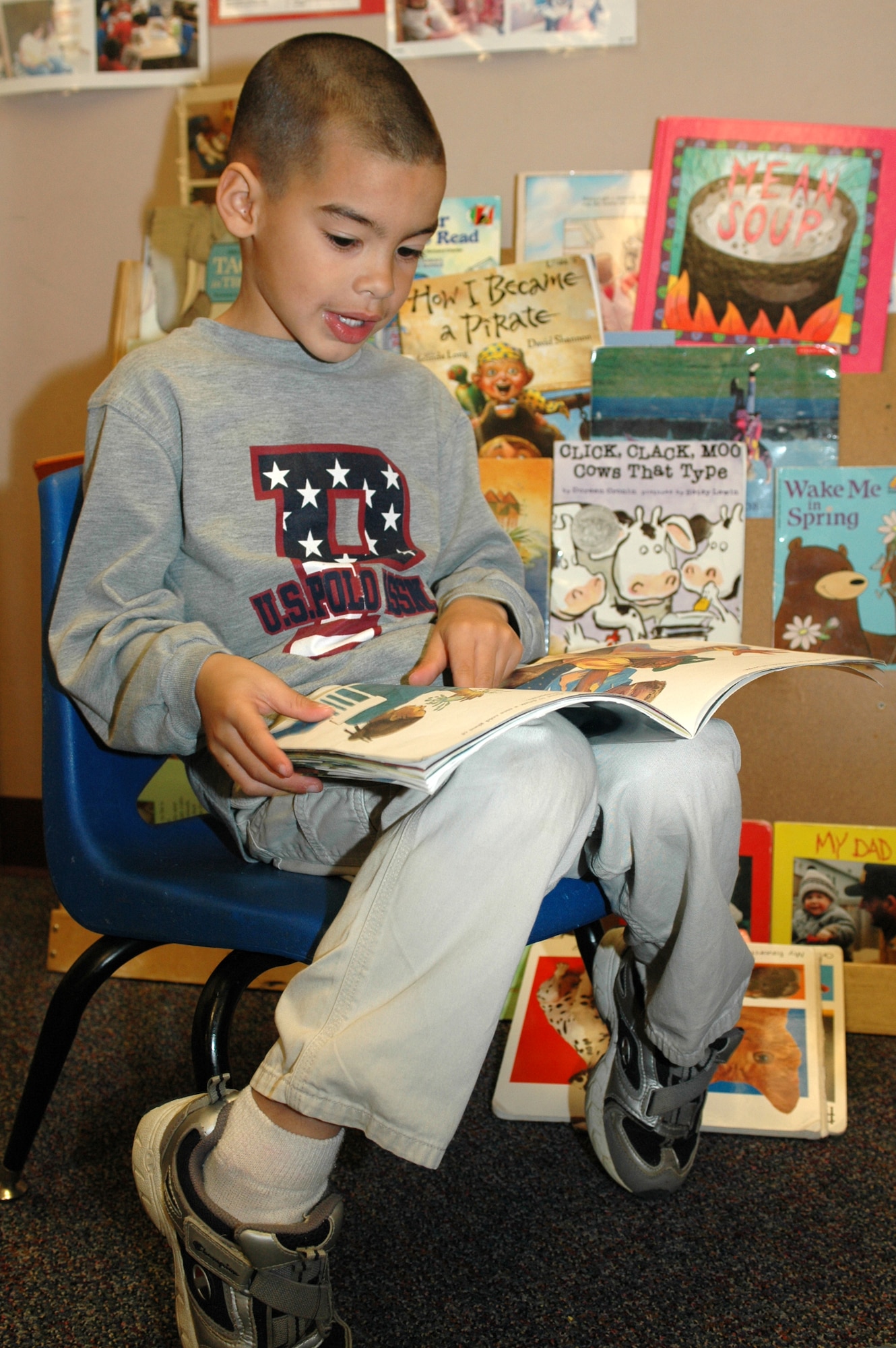 Manuel Visocsky, 5, reads a book in the Travis Head Start "library." (U.S. Air Force photo by Staff Sgt. Raymond Hoy)  