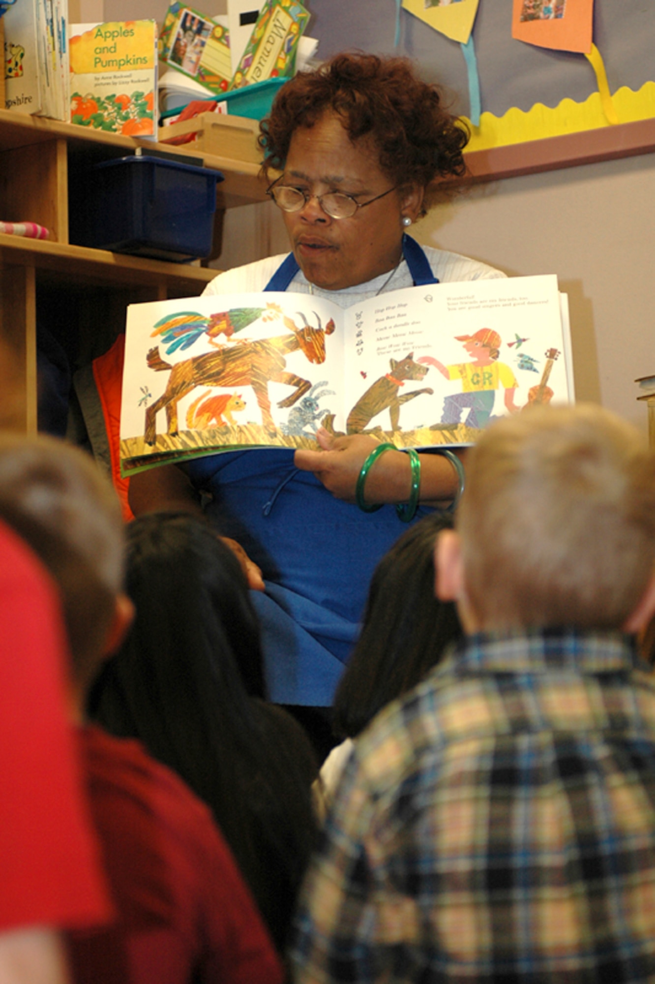 Mrs. Dorothea Wolfe, head teacher of the morning class, reads to the children during storytime. (U.S. Air Force photo by Staff Sgt. Raymond Hoy)