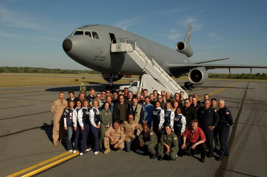 ROBINS Air Force Base, GA -- APRIL 5, 2006 -- Members of the Air Force Reserve Command- sponsored 2006 Patriotic World Tour prepare to board a KC-10 Extender from McGuire AFB, N.J., for their 16-day around-the-world trip.  The tour is headlined by Lee Greenwood, best known for his international hit "God Bless the U.S.A."  Also on the tour are the country music group; Restless Heart, stand-up comedian Dick Hardwick, and six members of the New England Patriots Cheerleaders.  The tour is also supported by U.S. Air Force bands.  The tour will make eight stops to perform for troops in Europe, the Middle East and the Pacific regions.  (U.S. Air Force Photo/Ken Hackman)