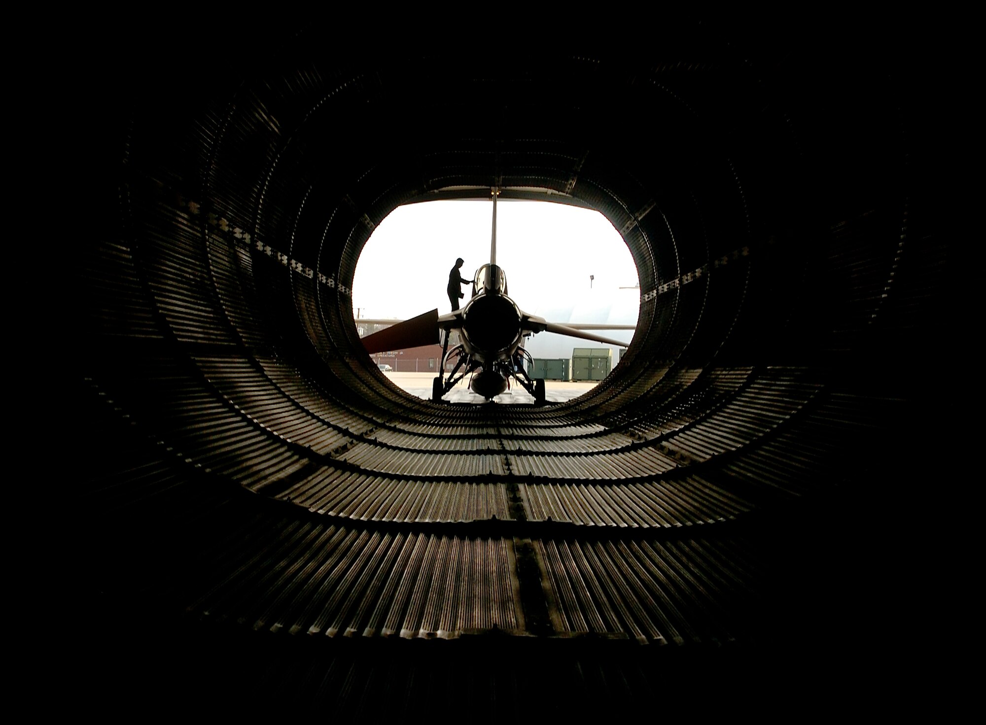 Tech. Sgt. Paul Holloway prepares an F-16 Fighting Falcon for engine run at the Virginia Air National Guard located at Sandstone, Va., on Friday, March 31, 2006.  The Virginia ANG is currently transitioning to the new F-22A Raptor at Langley Air Force Base and will replace the F-16s as early as October 2007.  Sergeant Holloway is a maintenance technician with the 192 Aircraft Maintenance Squadron.  (U.S. Air Force photo/Tech. Sgt. Ben Bloker)