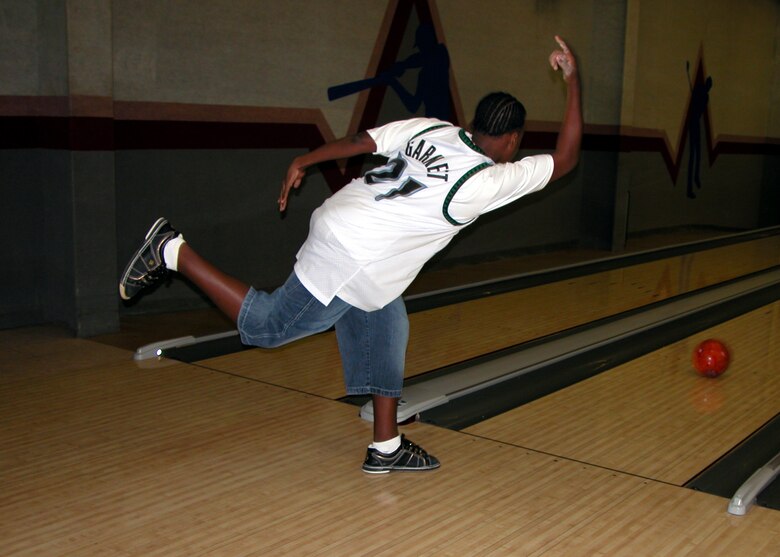 L.D. Dawn, son of Senior Master Sgt. Laraine Warren-Dawn, 917th Services Flight superintendent, practices bowling at the Barksdale Bowling Center Tuesday, March 28. (Photo by Staff Sgt. Ebony Nichols)