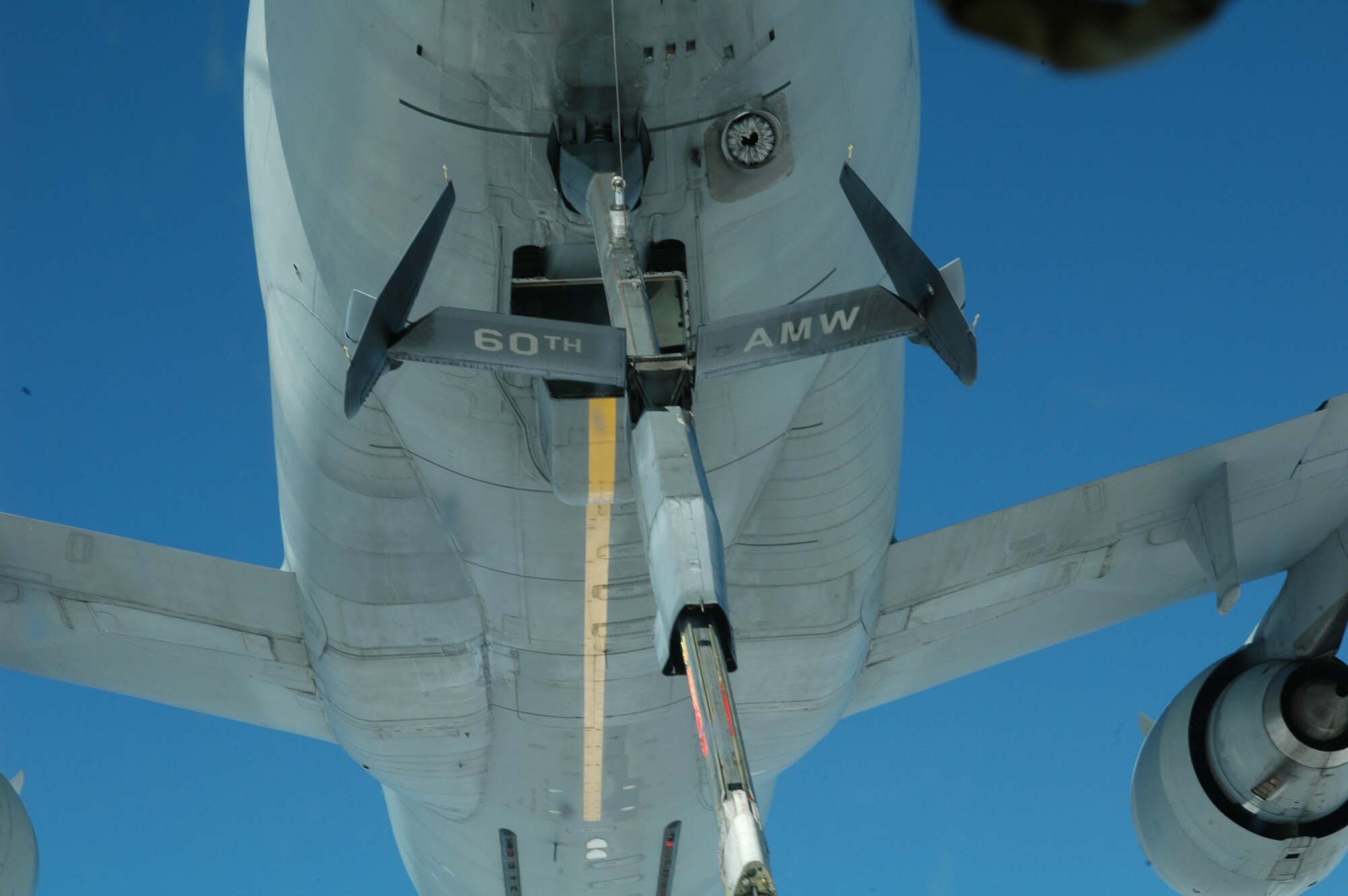 A Travis KC-10 approaches a C-5 seconds before first contact during the 21st Airlift Squadron's final C-5 flight March 31. The 21st AS officially transitioned from a C-5 squadron to a C-17 squadron in a ceremony here April 3, which was also the squadron’s 64th anniversary. (U.S. Air Force photo by Capt. Dominik Paul)