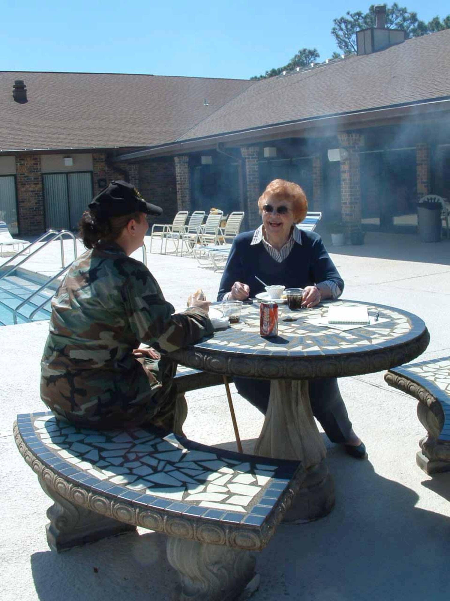 Air Force Enlisted Village resident Sue Lell and Senior Airman Heather Puhl share a laugh during their weekly visit at the village in Shalimar, Fla.  Airman Puhl, a psychology student at a nearby college, is studying the effects of aging.  She is assigned to the 728th Air Control Squadron at nearby Eglin Air Force Base.  (U.S. Air Force photo)