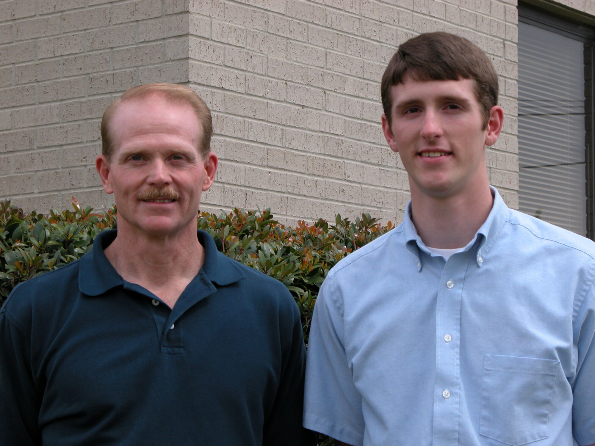 Master Sgt. Mark Poole, 917th Maintenance Group avionics test station supervisor, and his son, Eric (Photo by Staff Sgt. Ebony Nichols)