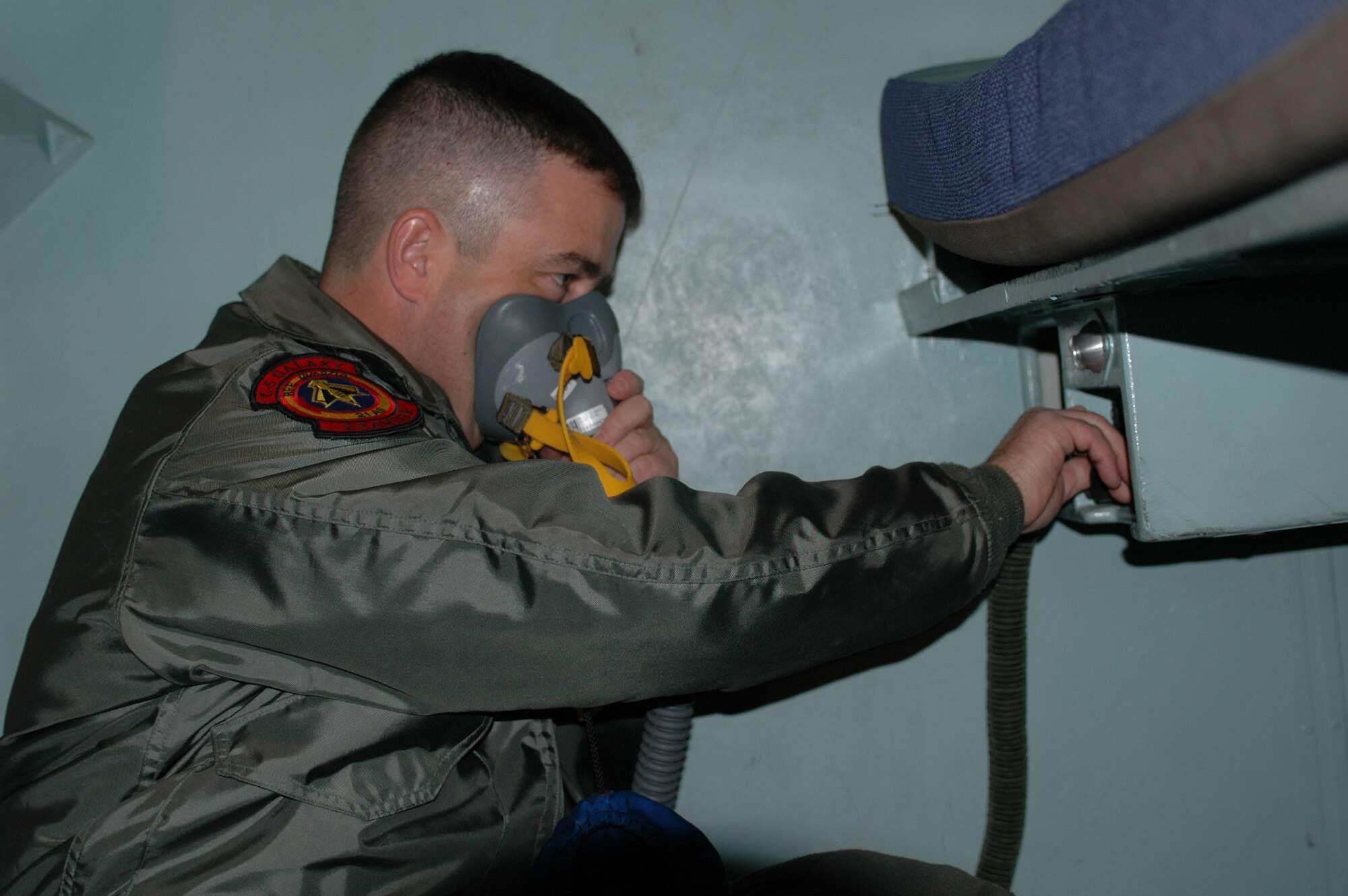 Senior Master Sgt. Richard Larsen, loadmaster, ensures the crew oxygen regulators in bunk rooms are working properly prior to the 21st Airlift Squadron's final C-5 flight departure March 31. The 21st AS officially transitioned from a C-5 squadron to a C-17 squadron in a ceremony here April 3, which was also the squadron’s 64th anniversary. (U.S. Air Force photo by Airman 1st Class Tiffany Low)