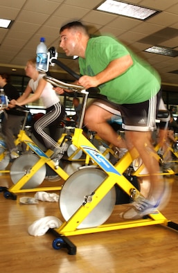 Anthony Sibilia gets a workout during the cycle segment of the aerobathon. The event officially ended the S.M.A.R.T. Goals fitness incentive program, a three-month program where participants set and attempted to accomplish fitness goals within that timeline. (U.S. Air Force photo by Nan Wylie)