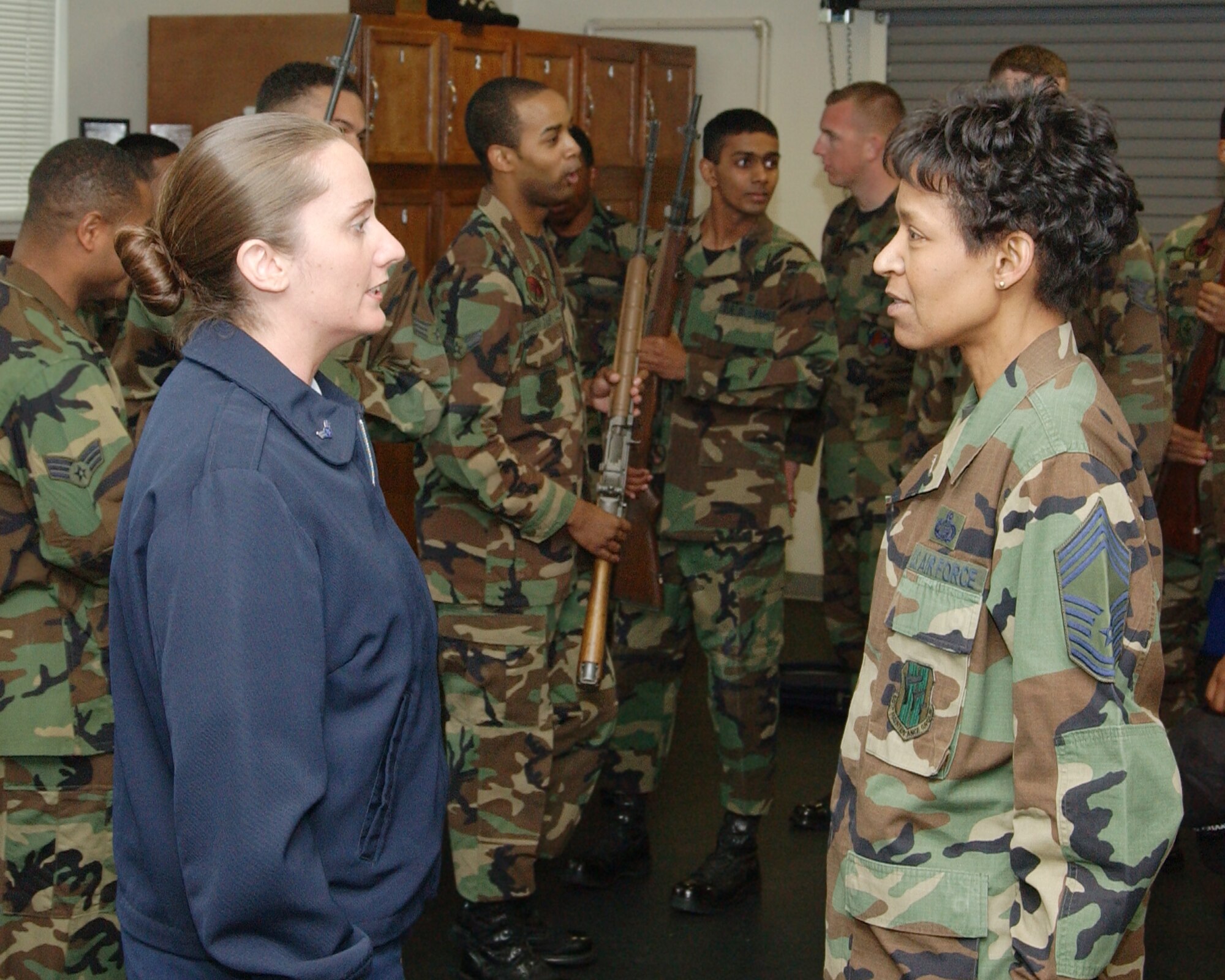 Airman 1st Class Melissa Rafferty, 60th Aerial Port Squadron, speaks with Chief Master Sgt. Carol Johnson, 60th Air Mobility Wing interim command chief. (U.S. Air Force photo by Luther Tolliver)