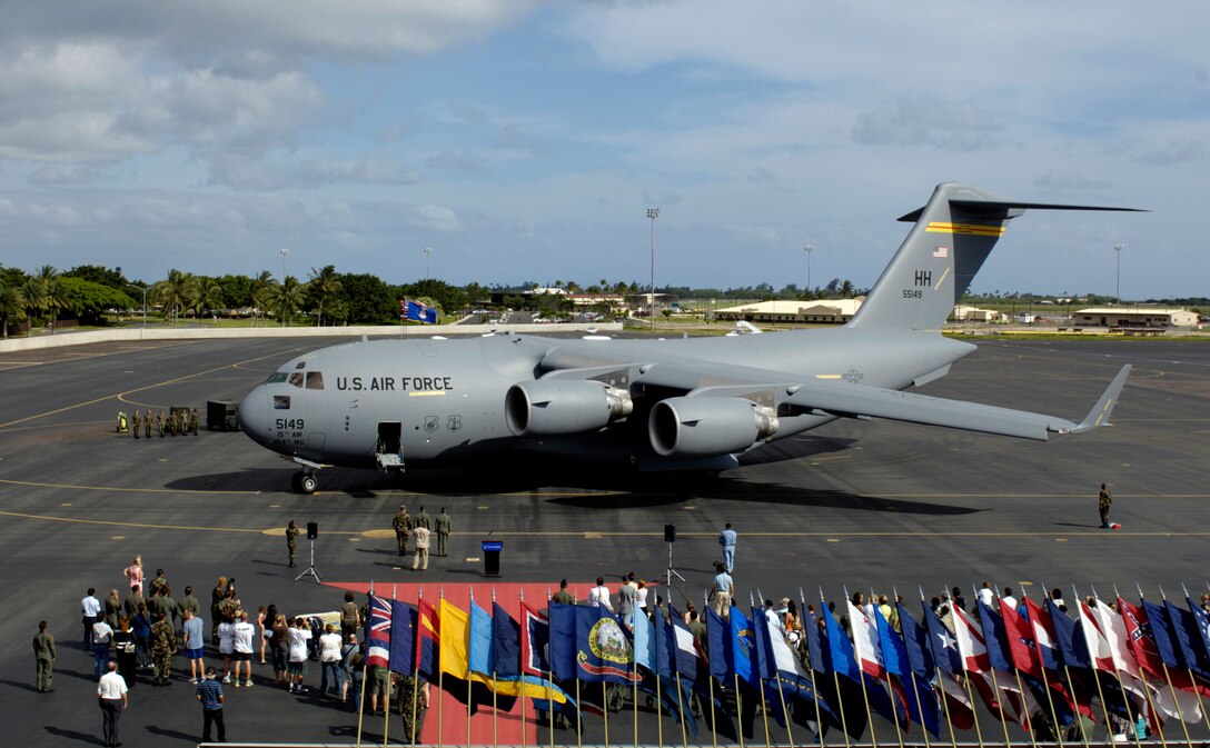 A C-17 Globemaster III arrives at its parking spot during a ceremony Saturday, April 8, 2006, at Hickam Air Force Base, Hawaii. This C-17 is the fourth to be assigned to Hickam. It will transition the 15th Airlift Wing and Hawaii Air National Guard's 154th Wing from training to operations.  (U.S. Air Force photo/Tech. Sgt. Shane A. Cuomo) 