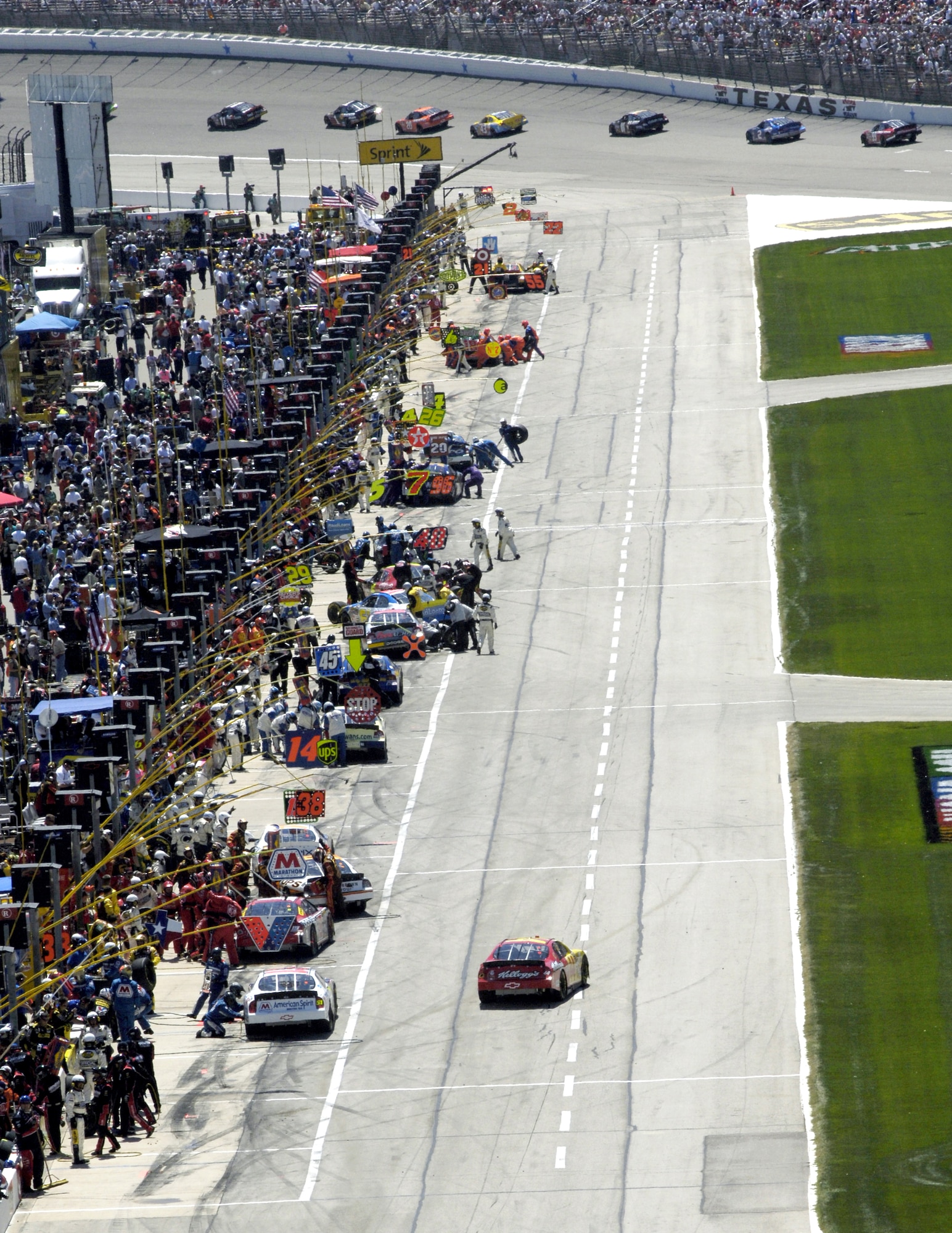 NASCAR Nextel Cup Series cars pit during the Samsung/RadioShack 500 on Sunday, April 9, 2006, at Texas Motor Speedway. Number 9 Kasey Kahne won the race, while the number 21 Motorcraft/Air Force car finished 16th in a field of 43 drivers. (U.S. Air Force photo/Senior Airman Brian Ferguson)