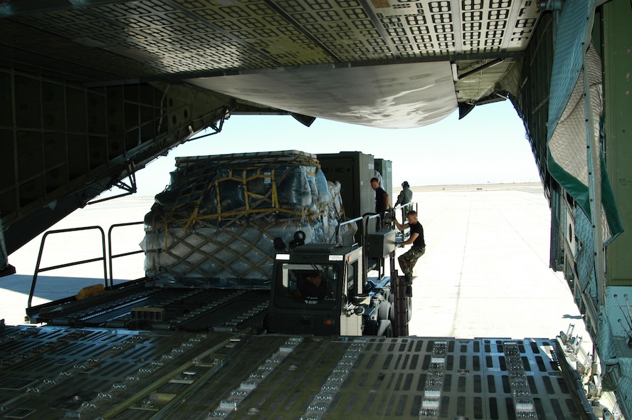 60th Aerial Port Squadron members load disaster relief supplies onto a C-5 aircraft headed for Biloxi, Miss. Travis Air Force Base, Calif. began relief efforts this week as a result of the Hurricane Katrina disaster. (US Air Force photoby T.C. Tolliver)