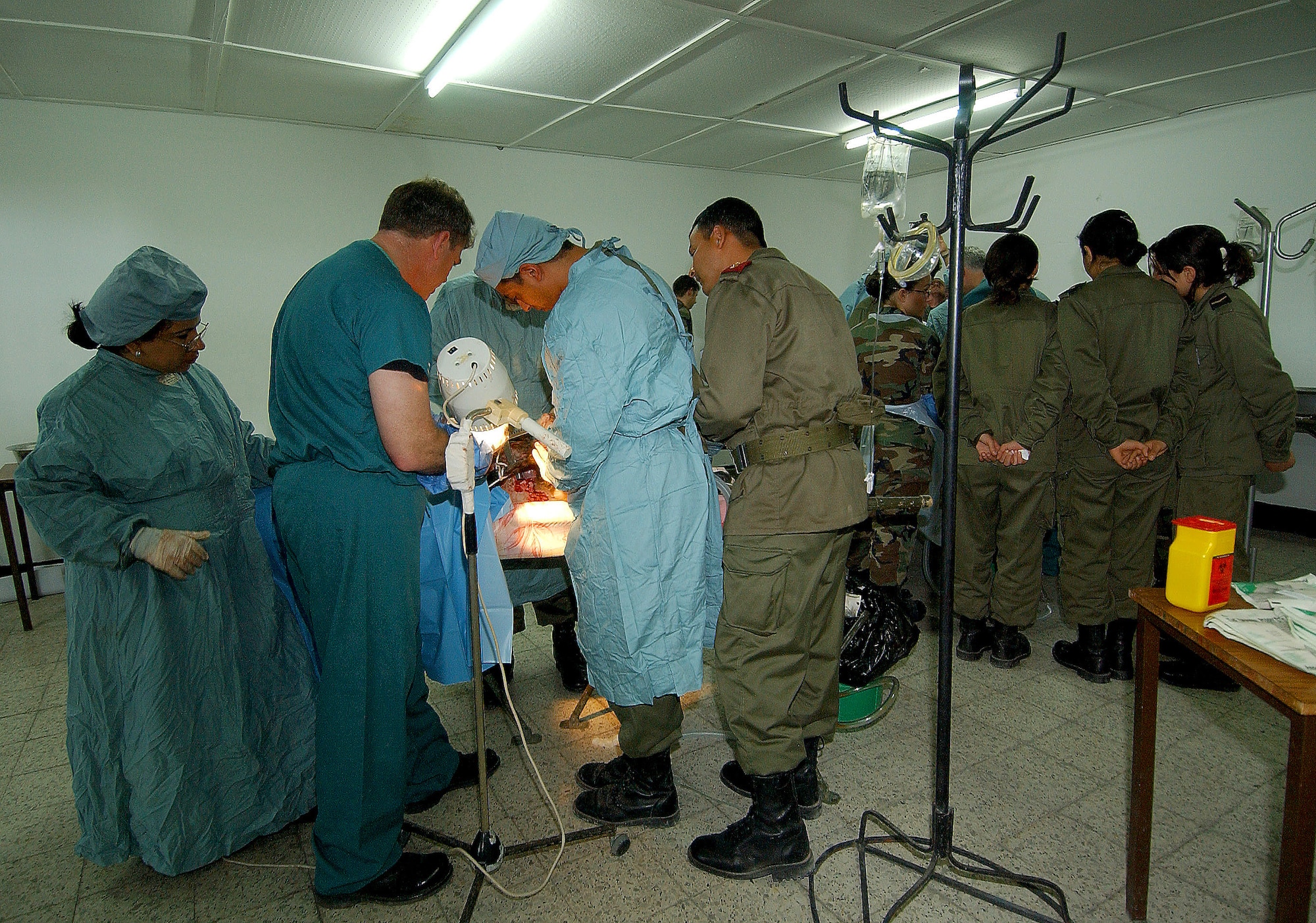 Air Force medical specialists and Tunisian military physicians perform trauma surgery on a goat as part of a refresher course for surgeons during Exercise MEDLite 2006 at Kharrouba Air Base, Tunisia, on Saturday, April 1, 2006. MEDLite 2006 provides the opportunity for Air Force medical specialists to exchange medical skills, techniques and procedures with Tunisian military medical personnel. (U.S. Air Force photo/Staff Sgt. Elizabeth Concepcion)