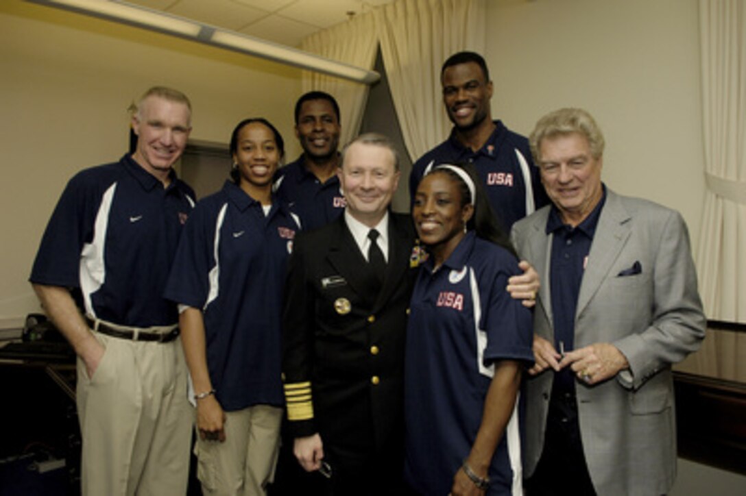 Vice Chairman of the Joint Chiefs of Staff Adm. Edmund G. Giambastiani Jr., U.S. Navy, poses for photos with members of Team USA in the Pentagon in Arlington, Va., on April 6, 2006. The basketball superstars are in the Pentagon to hold a special basketball clinic for children of deployed and active duty military members as part of April's "National Month of the Military Child." From left are: Chris Mullin, Chasity Melvin, Buck Williams, Giambastiani, Ruthie Bolton, David Robinson and Chuck Daly. 