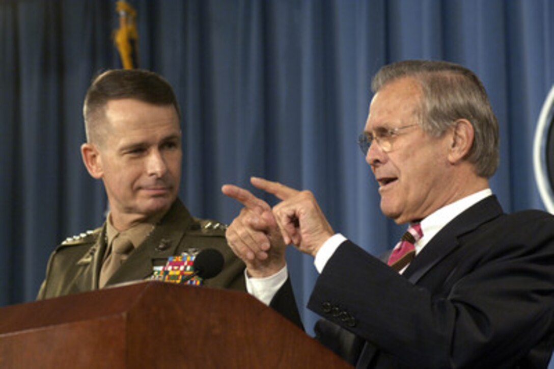 Secretary of Defense Donald H. Rumsfeld gestures as he makes his point to reporters during the Pentagon press briefing in Arlington, Va., on April 11, 2006. Rumsfeld and Chairman of the Joint Chiefs of Staff Gen. Peter Pace, U.S. Marine Corps, discussed timelines and prewar planning for Iraq. 