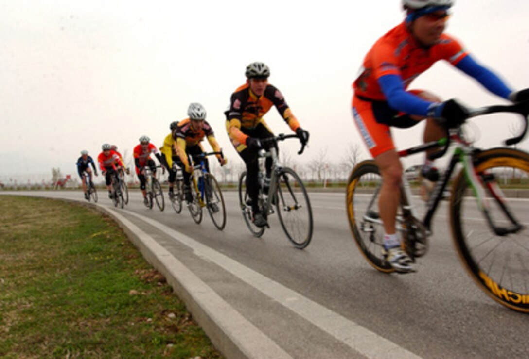 Military cyclists ride in a pace line as they compete in a road race at Aviano Air Base, Italy, during the 2006 United States Forces Europe cycling series on April 9, 2006. Military cyclists traveled from all over Europe to compete in the series of races, which also included mountain biking. 