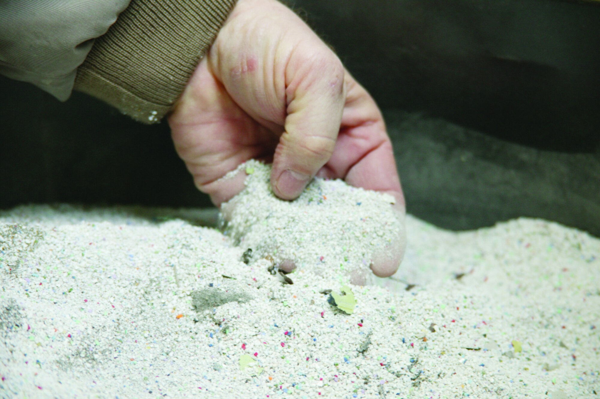 The system of environmentally-friendly plastic beads used to remove paint is one way pollution is prevented at Shaw Air Force Base. 
