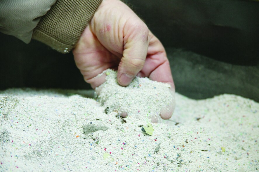 The system of environmentally-friendly plastic beads used to remove paint is one way pollution is prevented at Shaw Air Force Base. 