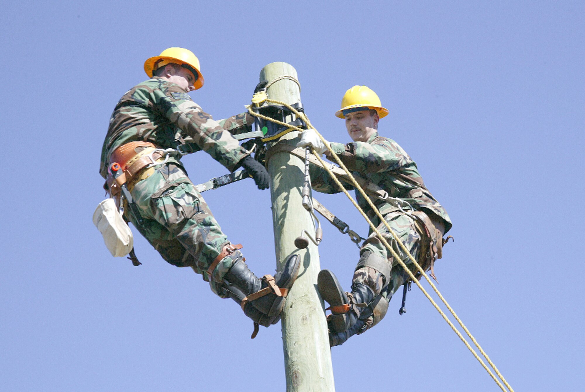 Staff Sgt. John Phillips (left) and Senior Airman Kenny Cox set up a training area so other 20th Civil Engineer Squadron electricians can practice as part of War Week in March 2006.