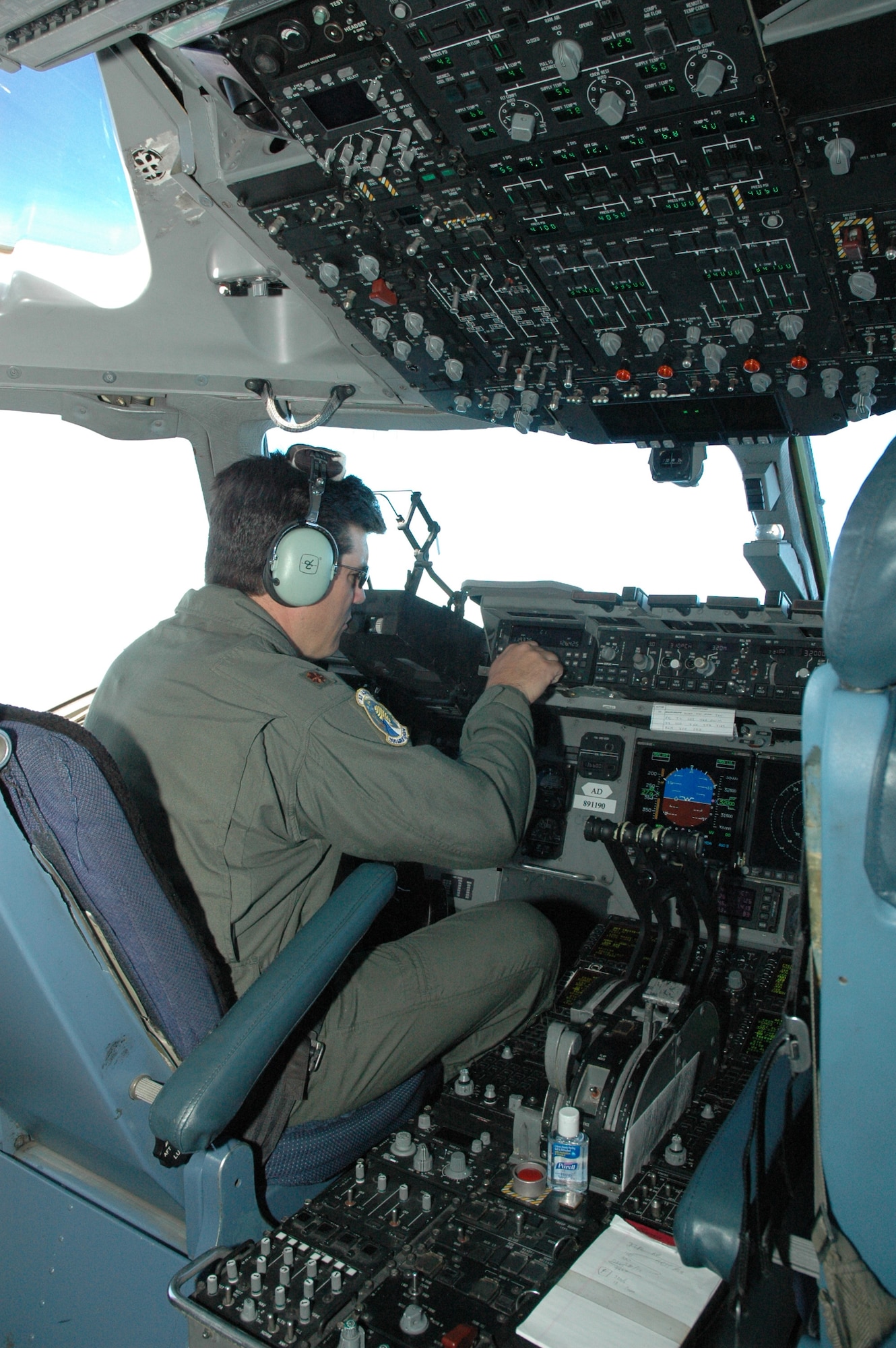 Maj. Mike Phillips, a reserve C-17 pilot assigned to the 300th Airlift Squadron, Charleston AFB, S.C., is evaluated on a "check-ride" during a training mission. (Photo by 1st Lt. Wayne Capps, USAFR)