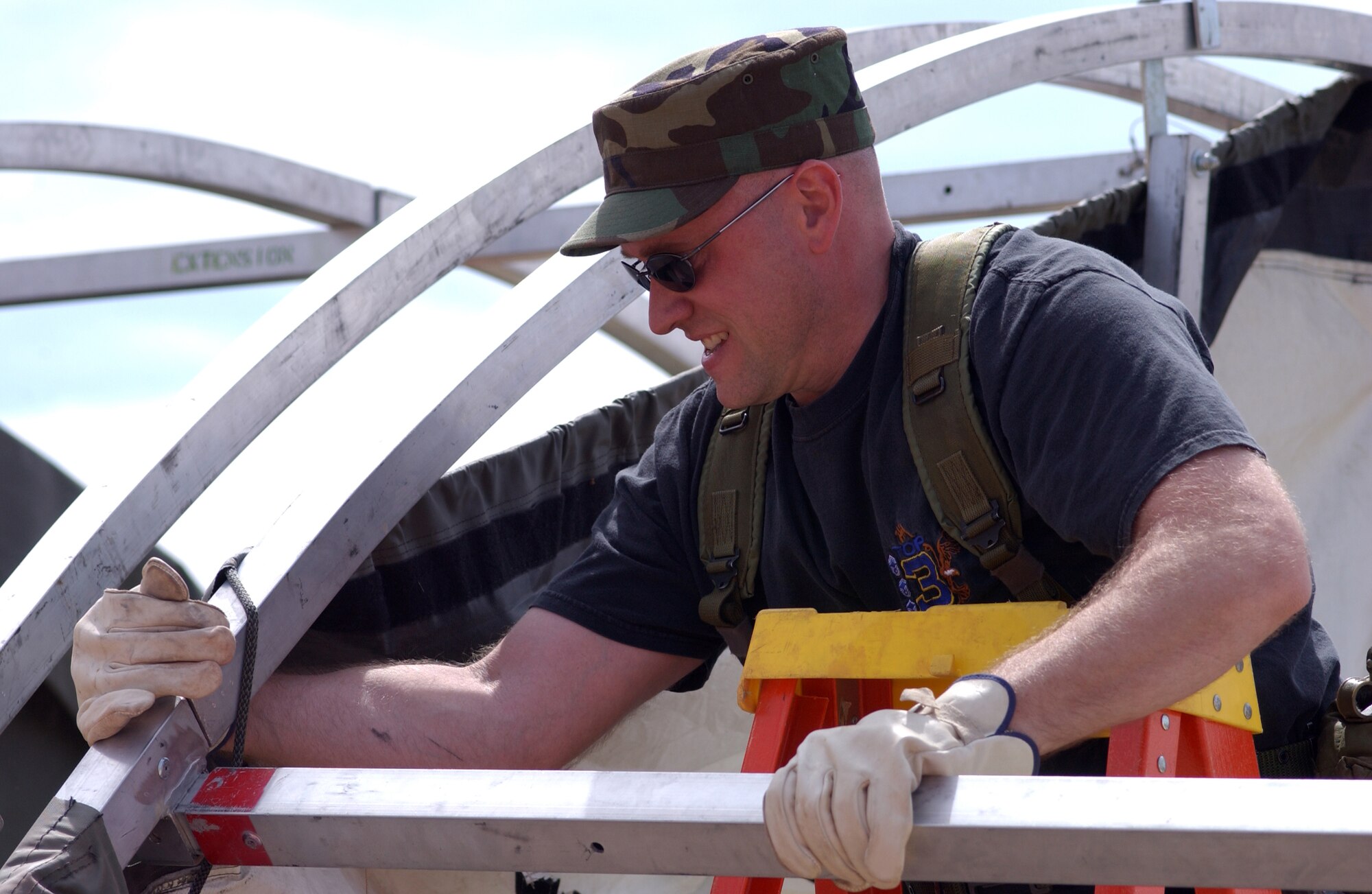 Master Sgt. Darin Andsager, 944th Medical Squadron, Luke Air Force Base, Ariz., assembles a mobile medical hospital during a regional training exercise April 3, 2006, at Papago Military Reservation in Phoenix. The hospital, also called an Expeditionary Medical Support Facility, is used for local emergencies much like those used during the Hurricane Katrina disaster or during deployed operations. About 500 military members, including active duty, Guard and Reserve, from across the United States are currently undergoing medical training including triage, medical command and control, medical air evacuation, patient management and transportation, and wound care as part of the "Coyote Crisis Campaign." Also participating in the campaign is the city of Scottsdale, Scottsdale Healthcare and General Dynamics. The training received during this exercise allows military members to work closely with community medical assets to prepare for events like natural disasters or terrorist attacks. (U.S. Air Force photo/Master Sgt. Garrett McClure)                             