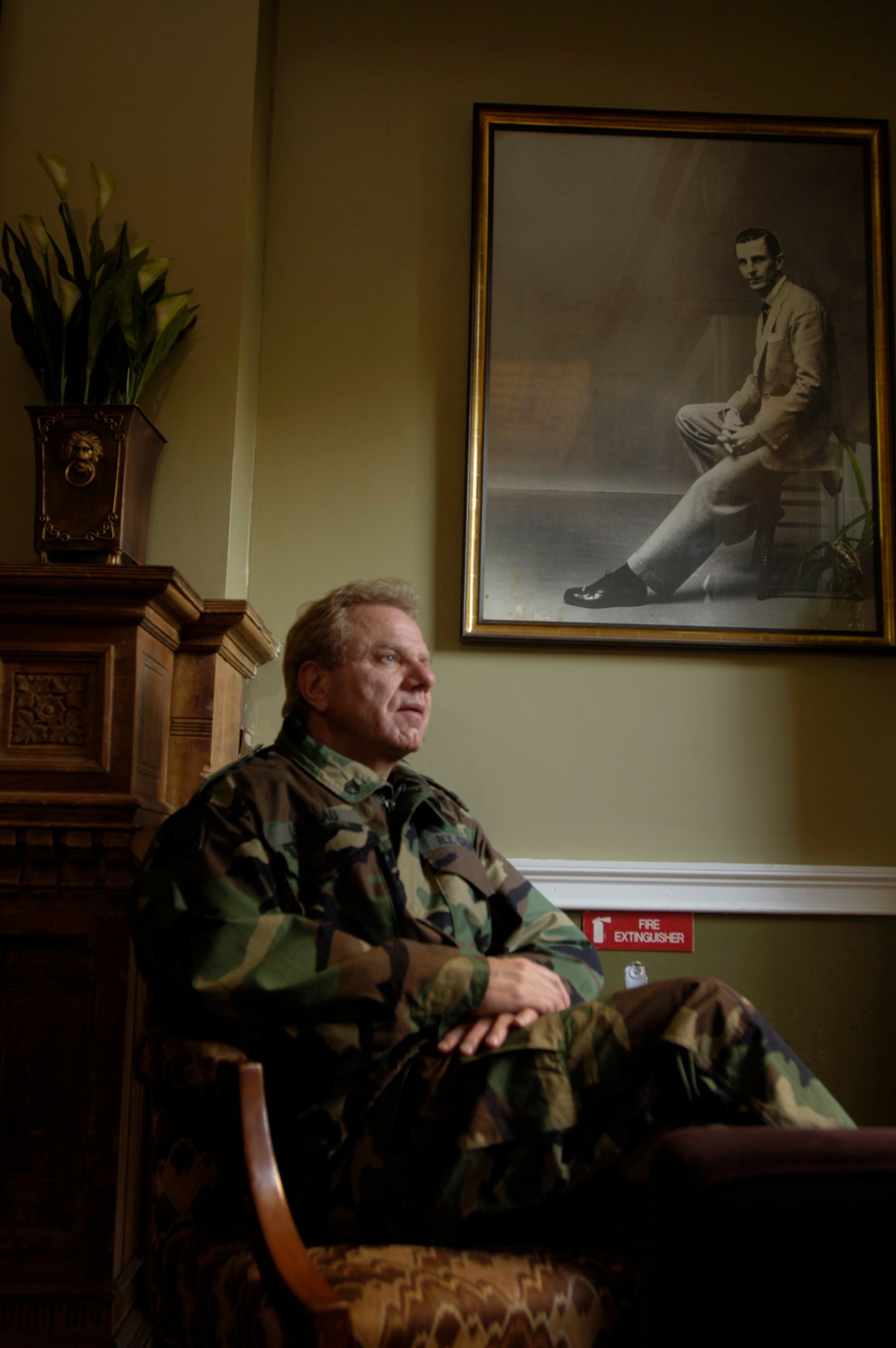 Peter LeBeau, executive director of the Soldiers', Sailors', Marines' and Airmen's Club, has been with the club since 2004. A dated portrait of Ivan Obolensky, SSMA Club chief executive officer and chairman, hangs on the wall.  (U.S. Air Force photo/Master Sgt. Scott Wagers) 
