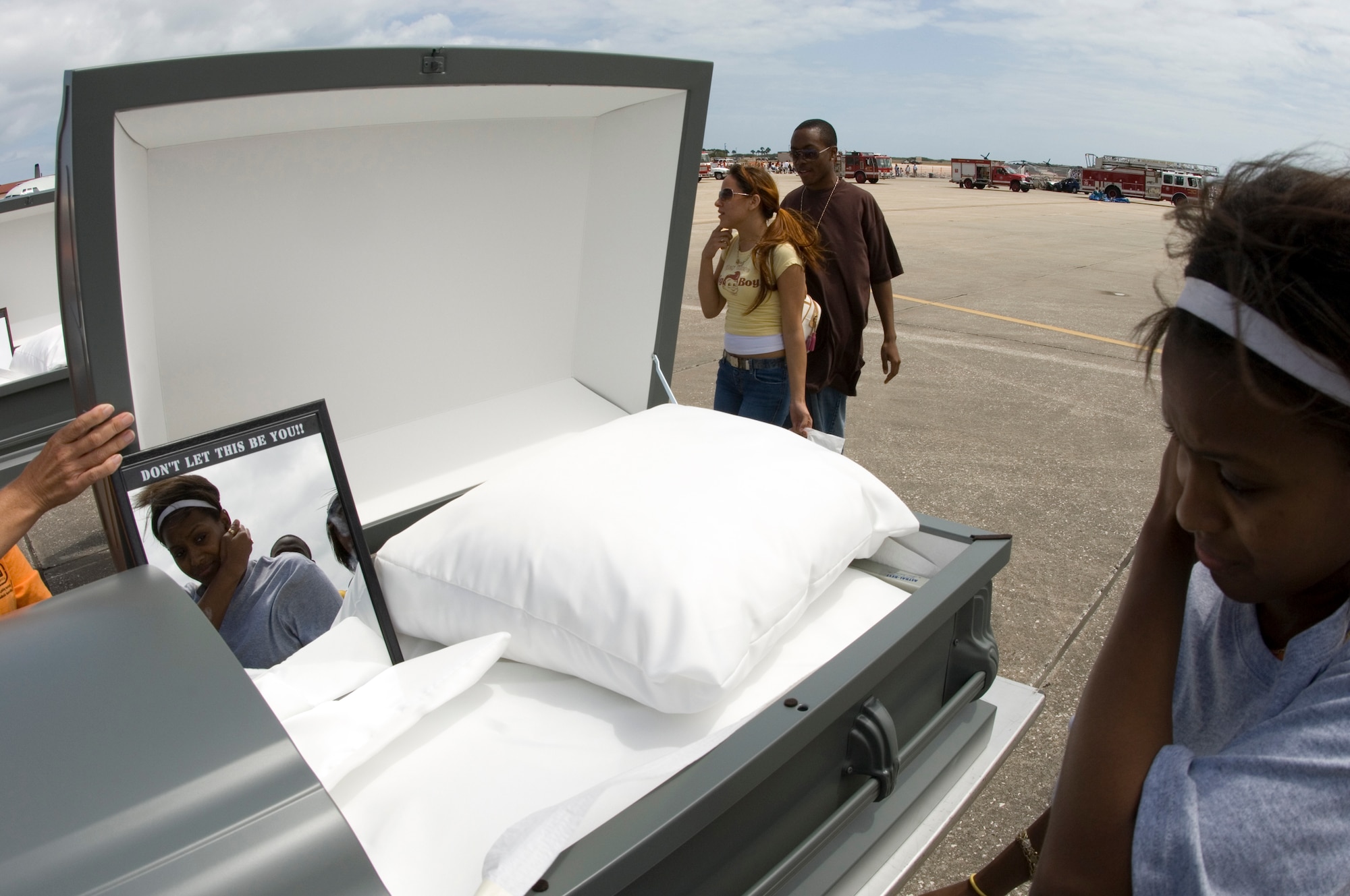 Students were asked to look into one of eight coffins as they left Operation NOW events on Tuesday, April 11, 2006, at Patrick Air Force Base, Fla. The eight coffins represent the eight Brevard County, Fla., teens killed in auto accidents last year. The events are designed to be graphic and "in your face" in the hopes of shocking teens into driving safer. (U.S. Air Force photo/Master Sgt. Jack Braden)