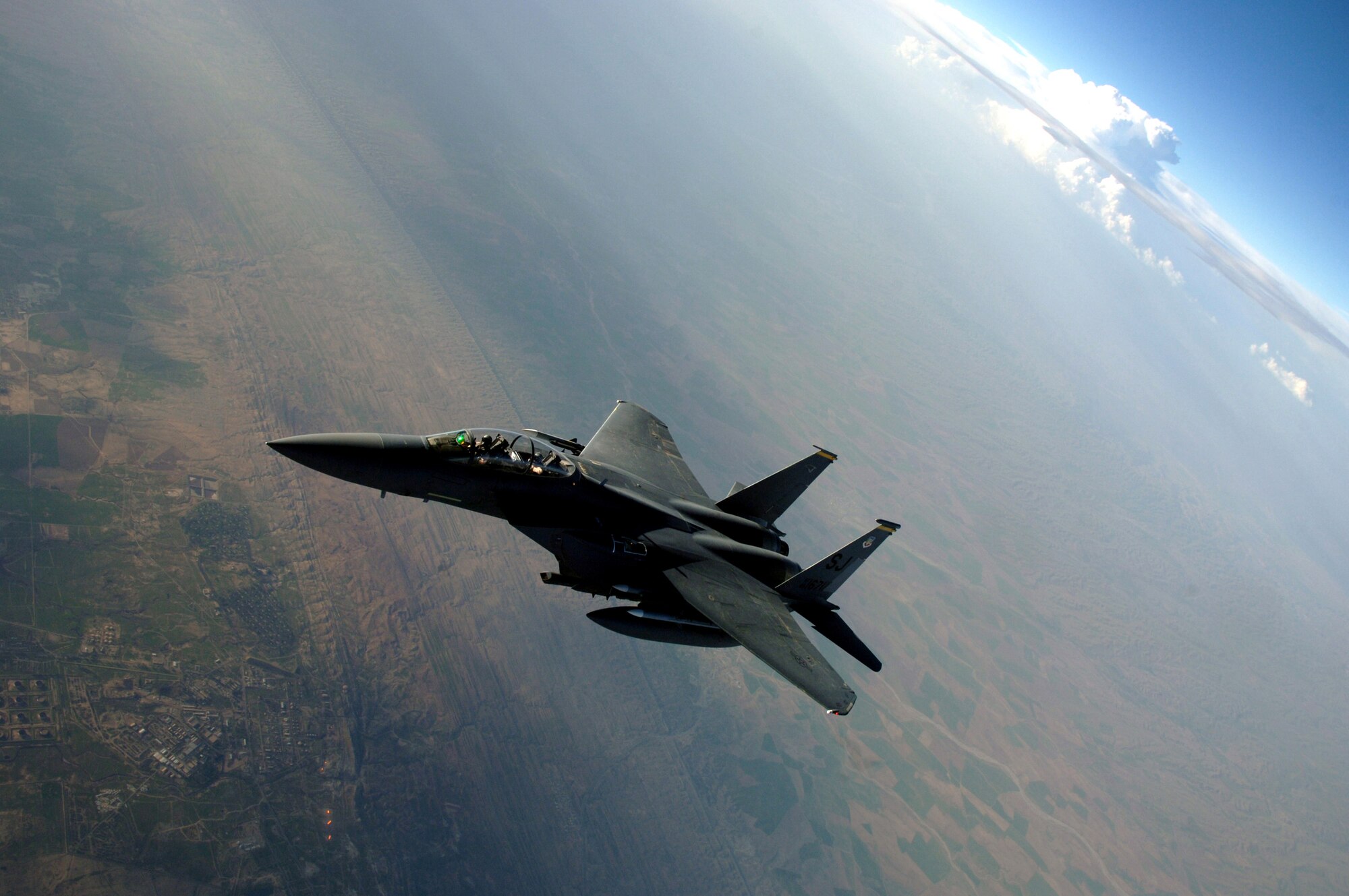 An F-15E Strike Eagle breaks away from a KC-135 Stratotanker after refueling over Southwest Asia on Tuesday, April 11, 2006. The F-15E is deployed to the 336th Expeditionary Fighter Squadron from Seymour Johnson Air Force Base, N.C. The KC-135 is deployed to the 340th Expeditionary Air Refueling Squadron from Fairchild Air Force Base, Wash. (U.S. Air Force photo/Staff Sgt. Joshua Strang)
