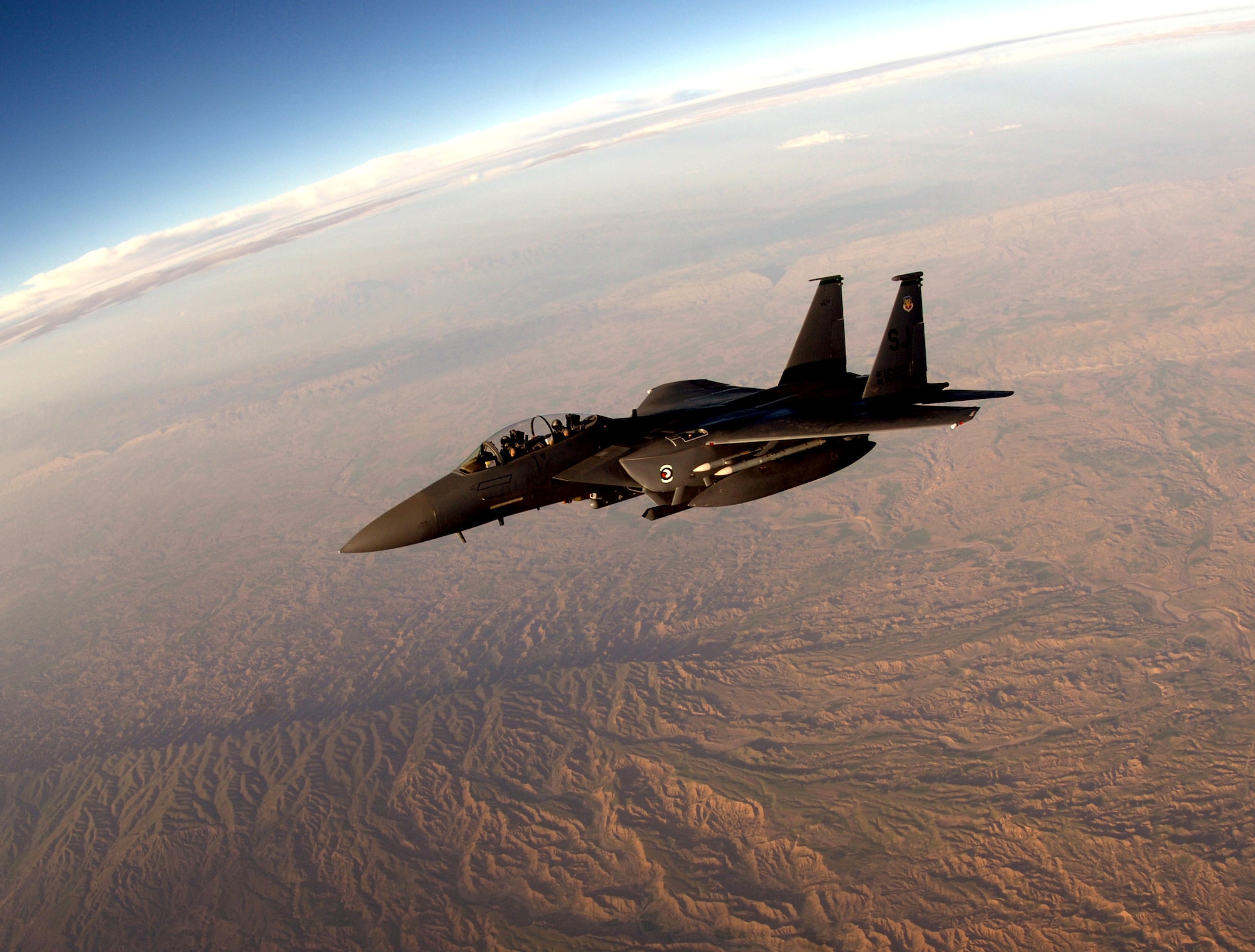 An F-15E Strike Eagle breaks away from a KC-135 Stratotanker after refueling over Southwest Asia on Tuesday, April 11, 2006.  The F-15E is deployed to the 336th Expeditionary Fighter Squadron from Seymour Johnson Air Force Base, N.C. The KC-135 is deployed to the 340th Expeditionary Air Refueling Squadron from Fairchild Air Force Base, Wash. (U.S. Air Force photo/Staff Sgt. Joshua Strang) 
