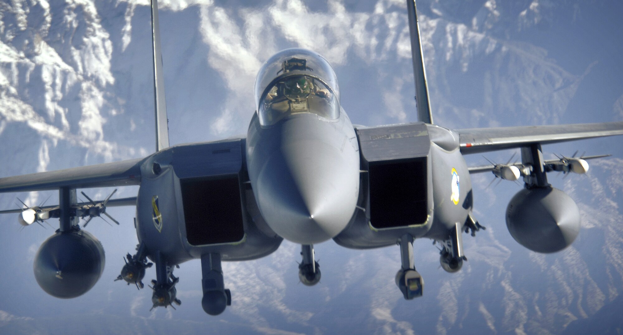 An F-15E Strike Eagle soars over the mountains of Afghanistan in support of Operation Mountain Lion on Wednesday, April 12, 2006. The crew and fighter are deployed to the 336th Expeditionary Fighter Squadron in Southwest Asia from the 4th Fighter Wing at Seymour Johnson Air Force Base, N.C. (U.S. Air Force photo/Master Sgt. Lance Cheung) 