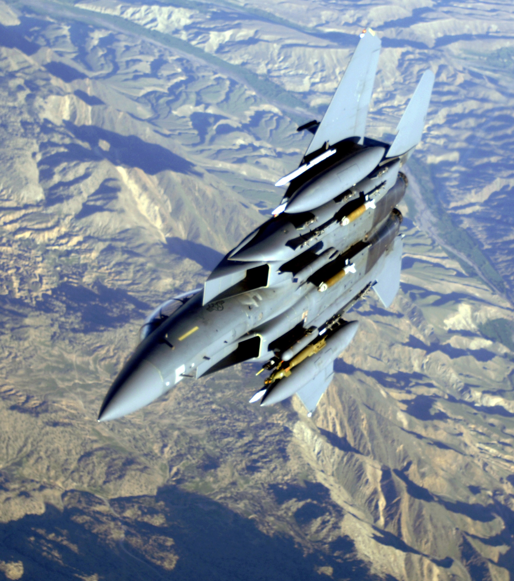 An F-15E Strike Eagle soars over the mountains of Afghanistan in support of Operation Mountain Lion on Wednesday, April 12, 2006. The crew and fighter are deployed to the 336th Expeditionary Fighter Squadron in Southwest Asia from the 4th Fighter Wing at Seymour Johnson Air Force Base, N.C. (U.S. Air Force photo/Master Sgt. Lance Cheung)