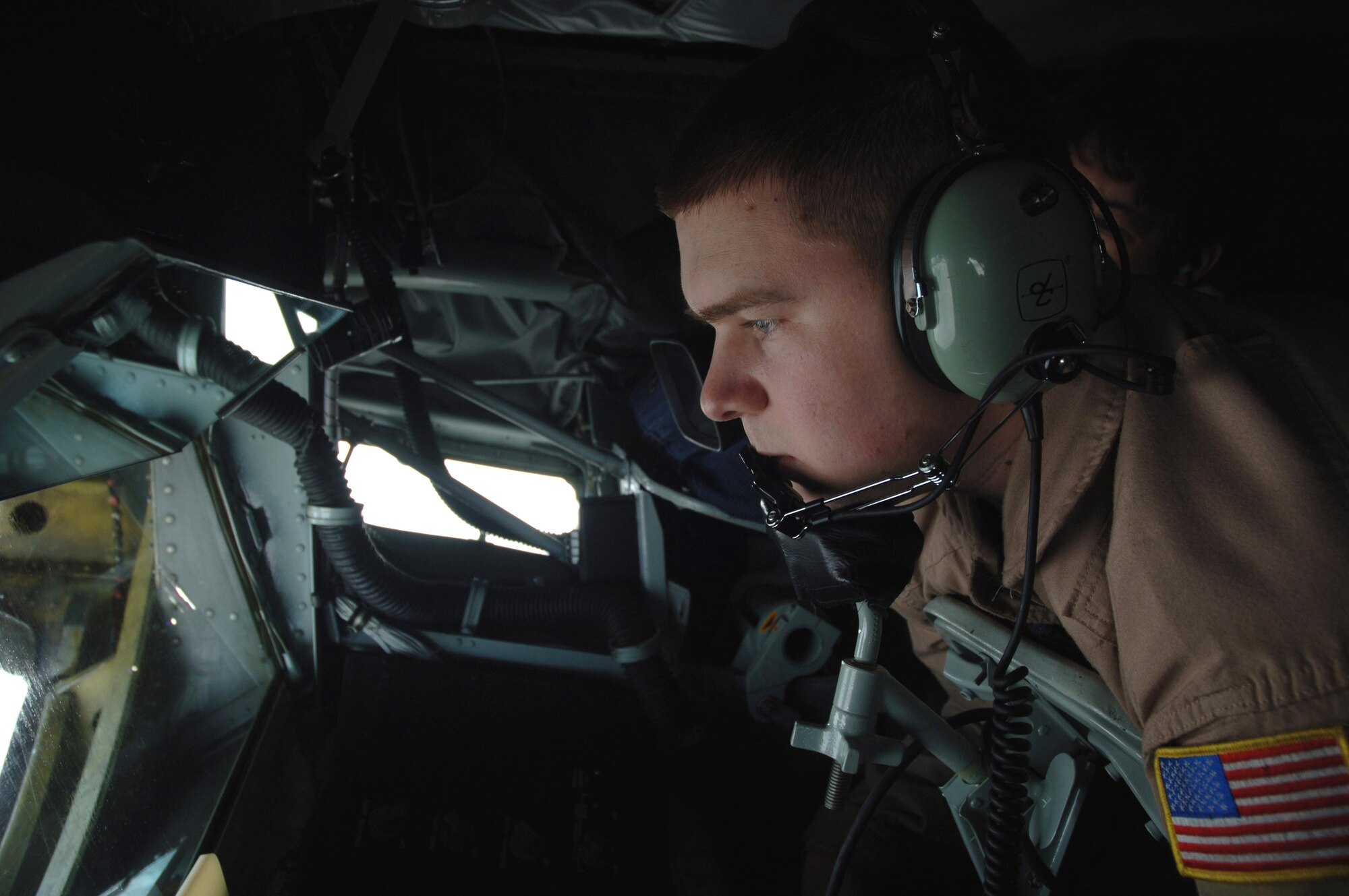Senior Airman Ryan Seifert refuels an F-15E Strike Eagle during a refueling mission over Southwest Asia on Tuesday, April 11, 2006. The KC-135 Stratotanker is from Fairchild Air Force Base, Wash. Airman Seifert is a boom operator with the 340th Expeditionary Air Refueling Squadron. (U.S. Air Force photo/Staff Sgt. Joshua Strang) 
