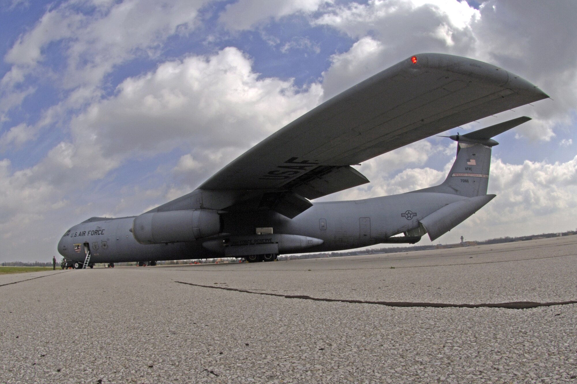 A C-141C Starlifter from the 445th Airlift Wing parks on the ramp at Scott Air Force Base, Ill., on Friday, April 7, 2006. The aircraft, tail number 67-0166, made its final flight. It will take its place among other Air Mobility Command aircraft at the heritage airpark being built this year. The 445th, based at Wright-Patterson Air Force Base, Ohio, is converting from the Starlifter to the C-5 Galaxy. (U.S. Air Force photo/Staff Sgt. Tony R. Tolley)