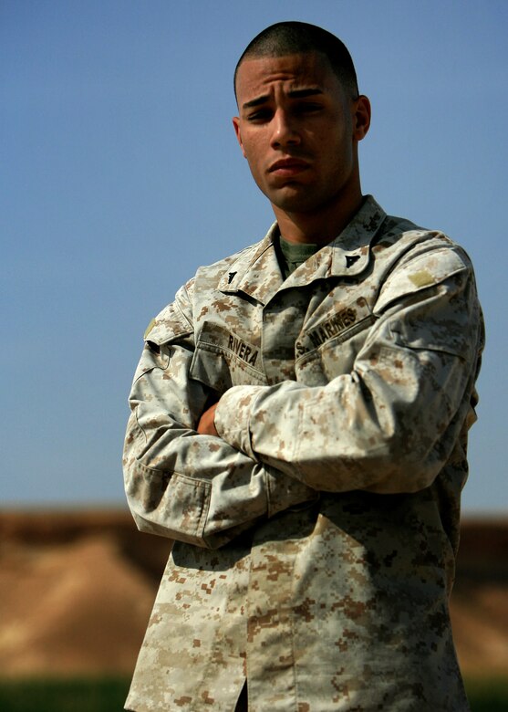 Lance Cpl. Mike A. Rivera poses for a photo April 13 outside of his workspace in Al Asad, Iraq. Rivera is a future operation clerk with Marine Wing Headquarters Squadron 3, 3rd Marine Aircraft Wing and he will be deployed to here for one year in support of Operation Iraqi Freedom.