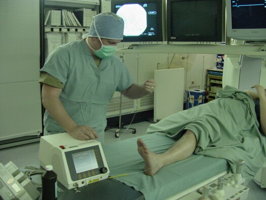 Staff Sgt. Ashley Hammonds, 60th Diagnostic and Therapeutics Squadron interventional radiology NCO in charge, demonstrates EndoVenous Laser Therapy with the use of the Angiodynamics laser. (Photo by Jim Spellman / 60th Medical Group Public Affairs)
