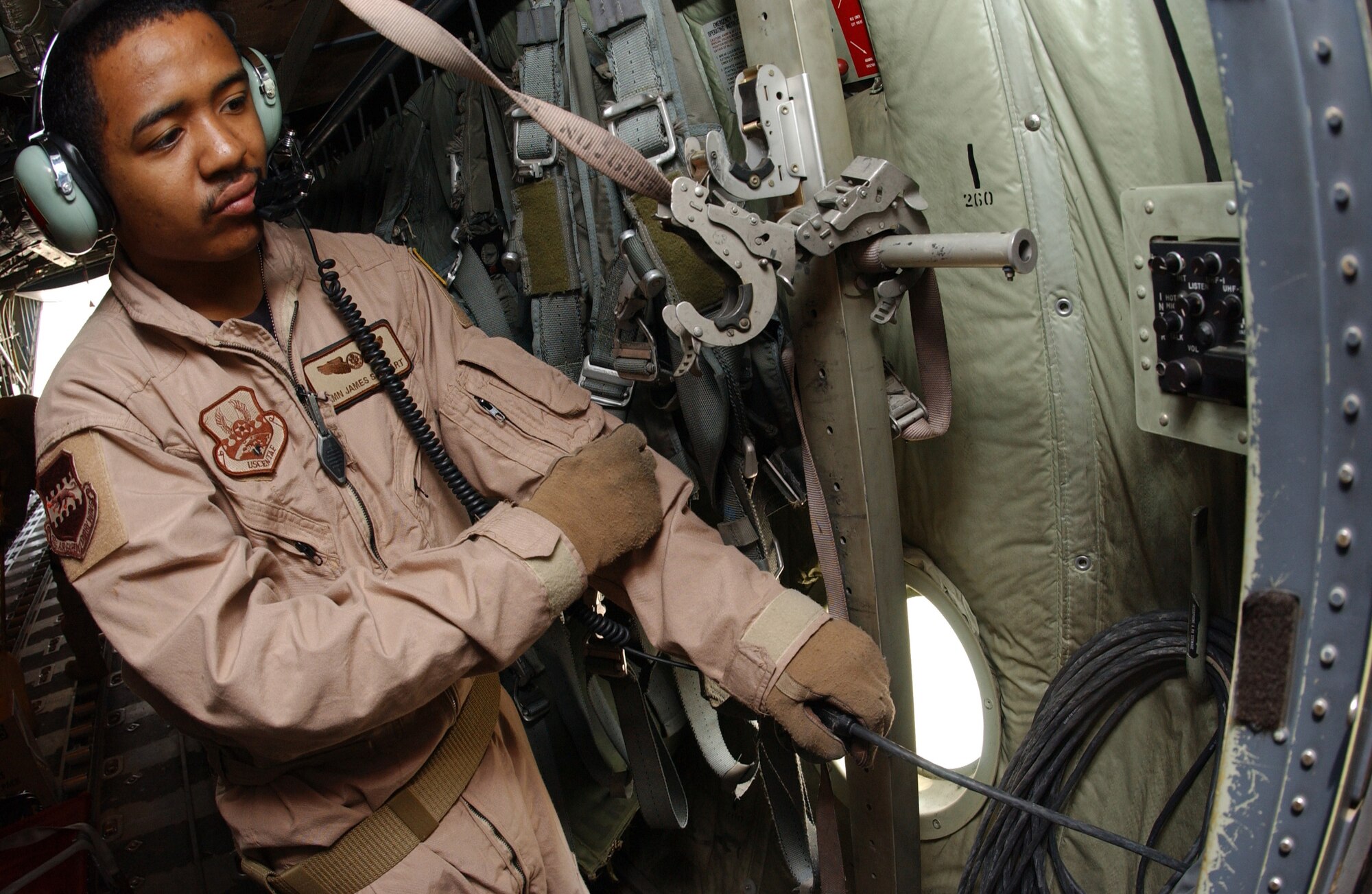 Airman James Stewart prepares his communication equipment for a flight out of Balad Air Base, Iraq, earlier this month. The Airman is with the 777th Expeditionary Airlift Squadron. (U.S. Air Force photo/Airman 1st Class Jason Ridder) 
