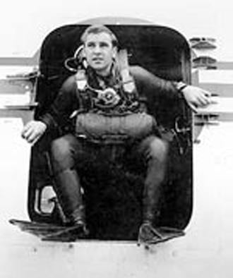 Airman 1st Class William H. Pitsenbarger in the doorway of an aircraft.