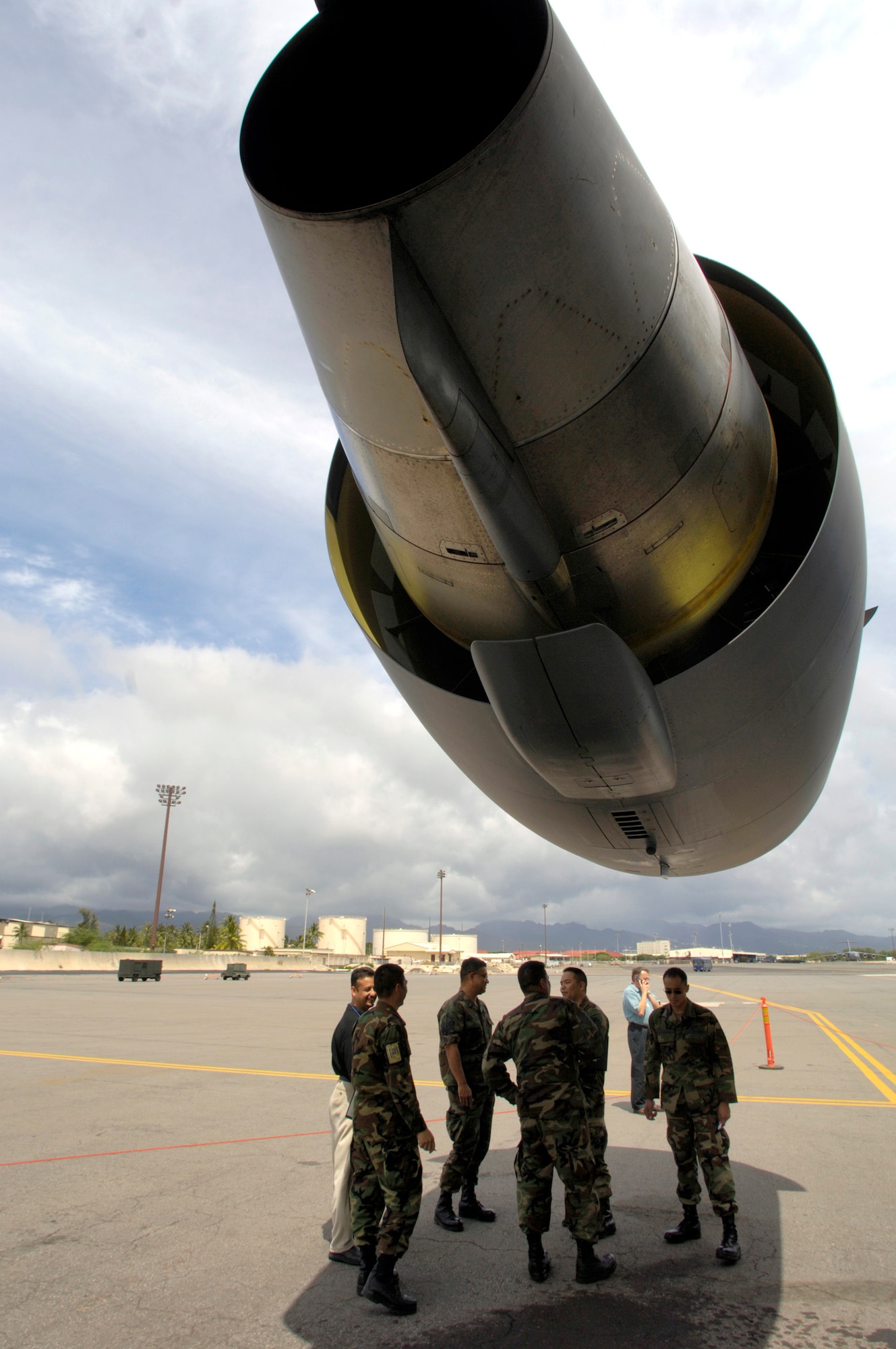 Boeing representatives and Airmen from the Hawaii Air National Guard's 154th Maintenance Squadron discuss maintenance procedures for a C-17 Globemaster III at Hickam Air Force Base, Hawaii, on Tuesday, April 11, 2006. The guardsmen are learning how to streamline their maintenance processes. (U.S. Air Force photo/Tech. Sgt. Shane A. Cuomo)