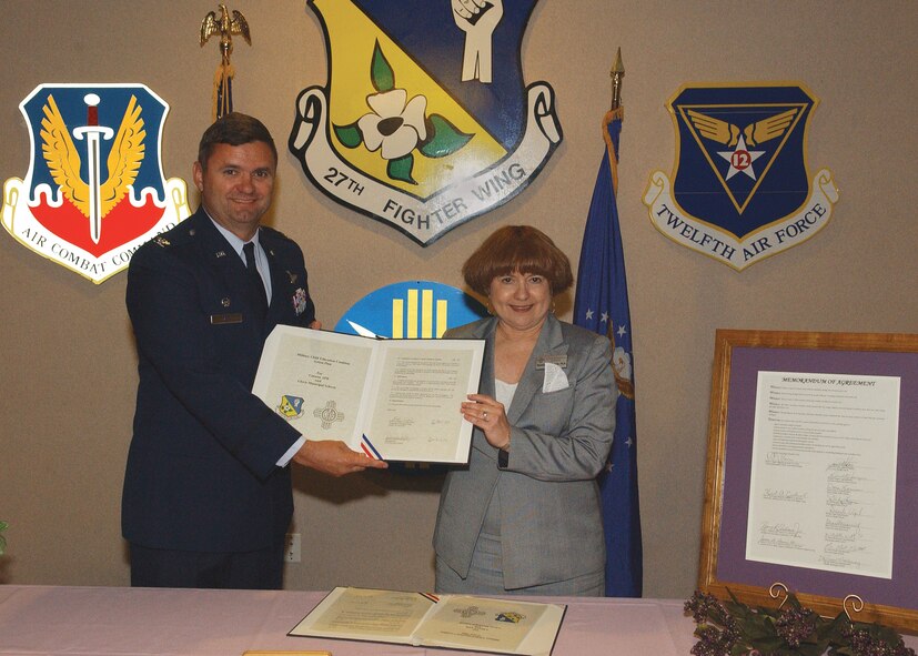 CANNON AIR FORCE BASE, N.M. -- The Military Child Education Coalition action plan was signed April 7 by Col. Scott West, 27th Fighter Wing commander and Dr. Rhonda Seidenwurm, Clovis Municipal School superintendent. 
The action plan is a milestone in the continuing partnership between Cannon and Clovis Municipal Schools.
The purpose of the plan is to ease the transition of military dependant school children as they move into community schools and activities.
“I appreciate the commitment of Clovis Municipal Schools to expand opportunities for all students,” said Colonel West. “The plan required a lot of discusssion on the balance between fairness and opportunity”.
Lt. Col. James Lewis, 27th Mission Support Group deputy commander, who serves as a liaison between Cannon and Clovis Municipal Schools said Cannon is “fortunate to have such a strong relationship with the school administration. We have worked so closely in so many things,” adding that he thinks this relationship is one of the strongest in the country.
 (U.S. Air Force photo by Staff Sgt. Michael Welch)