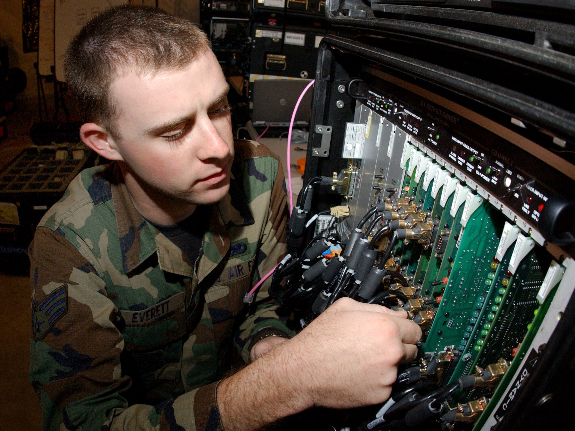 Senior Airman Scott Everett ensured that voice and data are working during Exercise Jump Start on Thursday, April 13, 2006, at Homestead Air Reserve Base, Fla. The communications exercise is designed to familiarize troops from Reserve, Guard and active military units with equipment they wouldn't normally use. Airman Everett is a computer, cryptographic and switching systems technician with the 452nd Communications Squadron at March ARB, Calif. (U.S. Air Force photo/Airman 1st Class Bradley Lail)