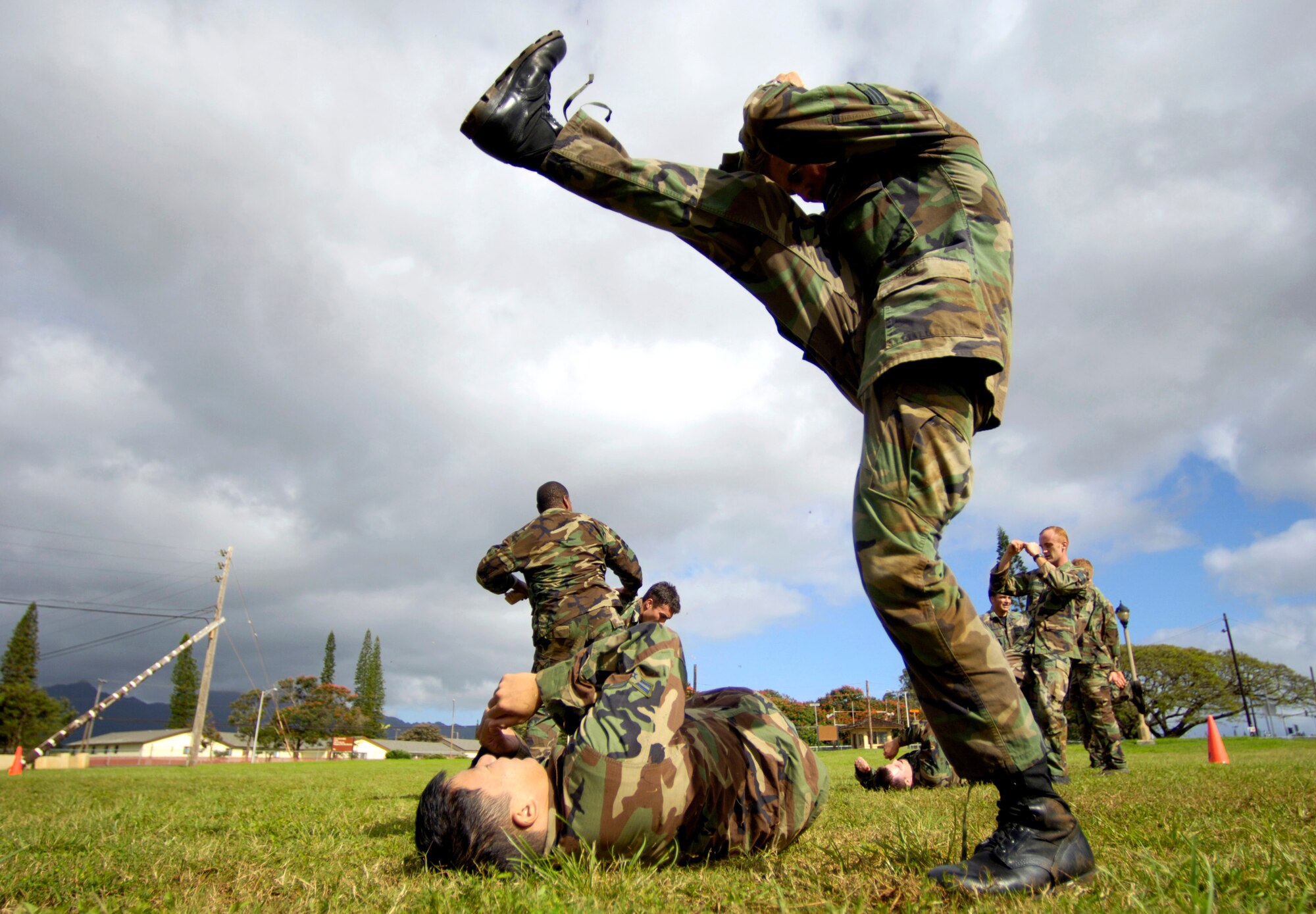 Senior Airman Glenn Wilderman practices close-combat skills with Airman 1st Class Clayton Yeung on Thursday, April 13, 2006, at Wheeler Army Air Field, Hawaii. Airmen Wilderman and Yeung are tactical air controllers from the 25th Air Support Operation Squadron. (U.S. Air Force photo/Tech. Sgt. Shane A. Cuomo)