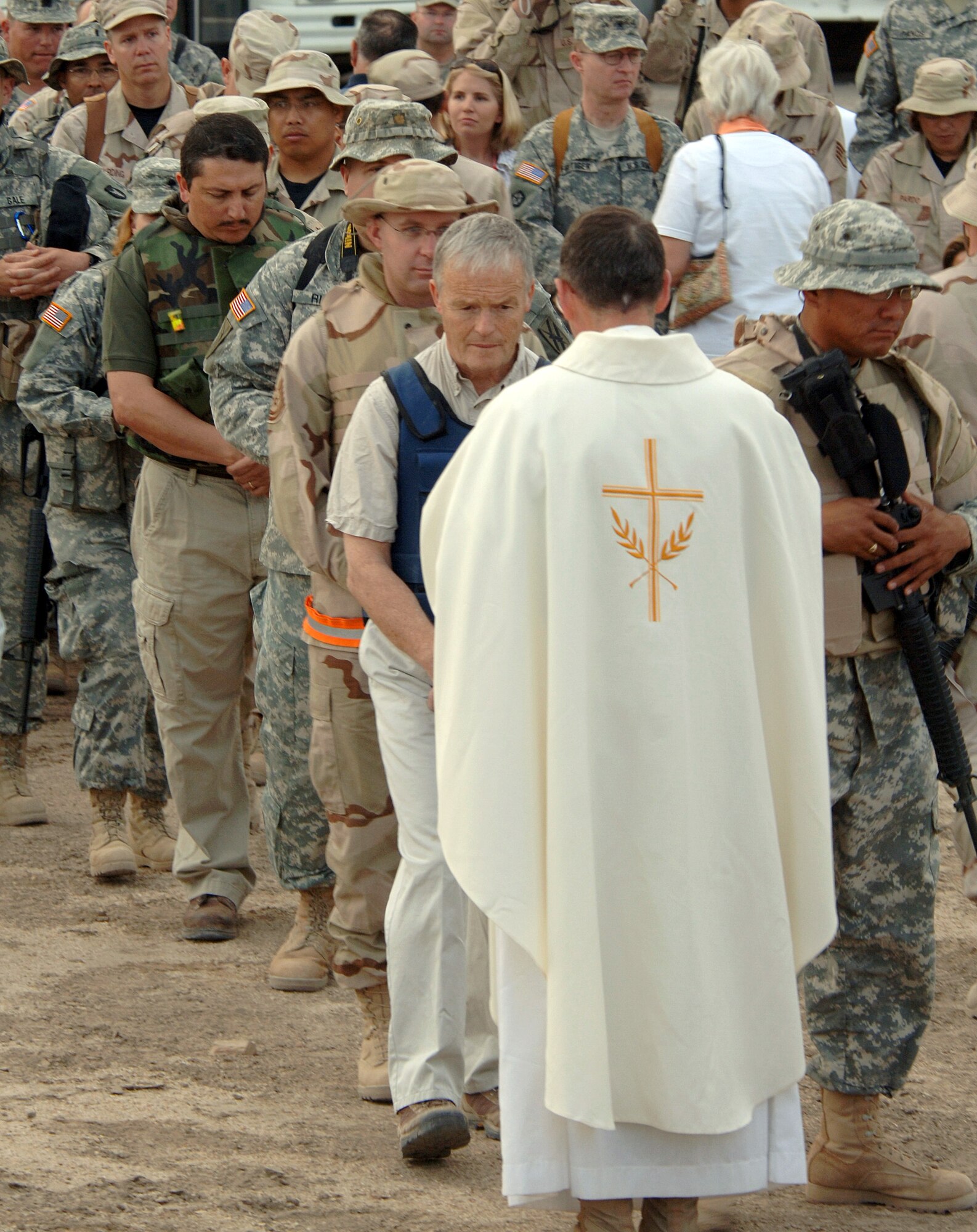 Chaplain (Maj.) Larry Bailey delivers the Holy Eucharist to servicemembers from Ali Base, Iraq, during Easter service at the House of Abraham in Ur, Iraq, on Sunday, April 16, 2006. Abraham is considered by religious scholars to be the father of three religions: Islam, Judaism and Christianity. Chaplain Bailey is assigned to the 407th Air Expeditionary Group (U.S. Air Force photo/Staff Sgt. Valerie Smith)