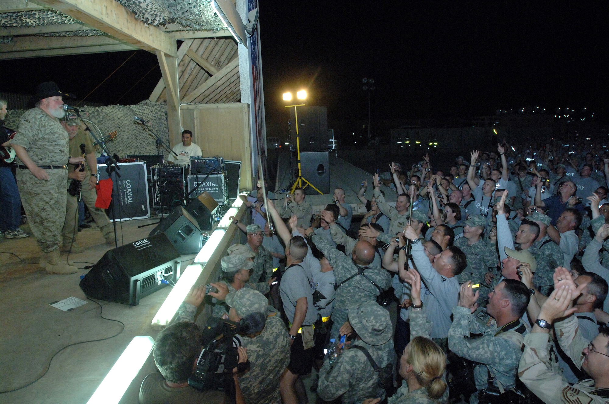 The Charlie Daniels Band plays for military members of Ali Base, Iraq, on Saturday, April 15, 2006, as part of Stars for Stripes, a nonprofit organization which works with Armed Forces Entertainment and U.S. Army Europe Morale, Welfare and Recreation to bring celebrity entertainment to remote sites. The Charlie Daniels Band has been entertaining U.S. military troops around the world for more than 35 years. (U.S. Air Force photo/Staff Sgt. Valerie Smith) 

