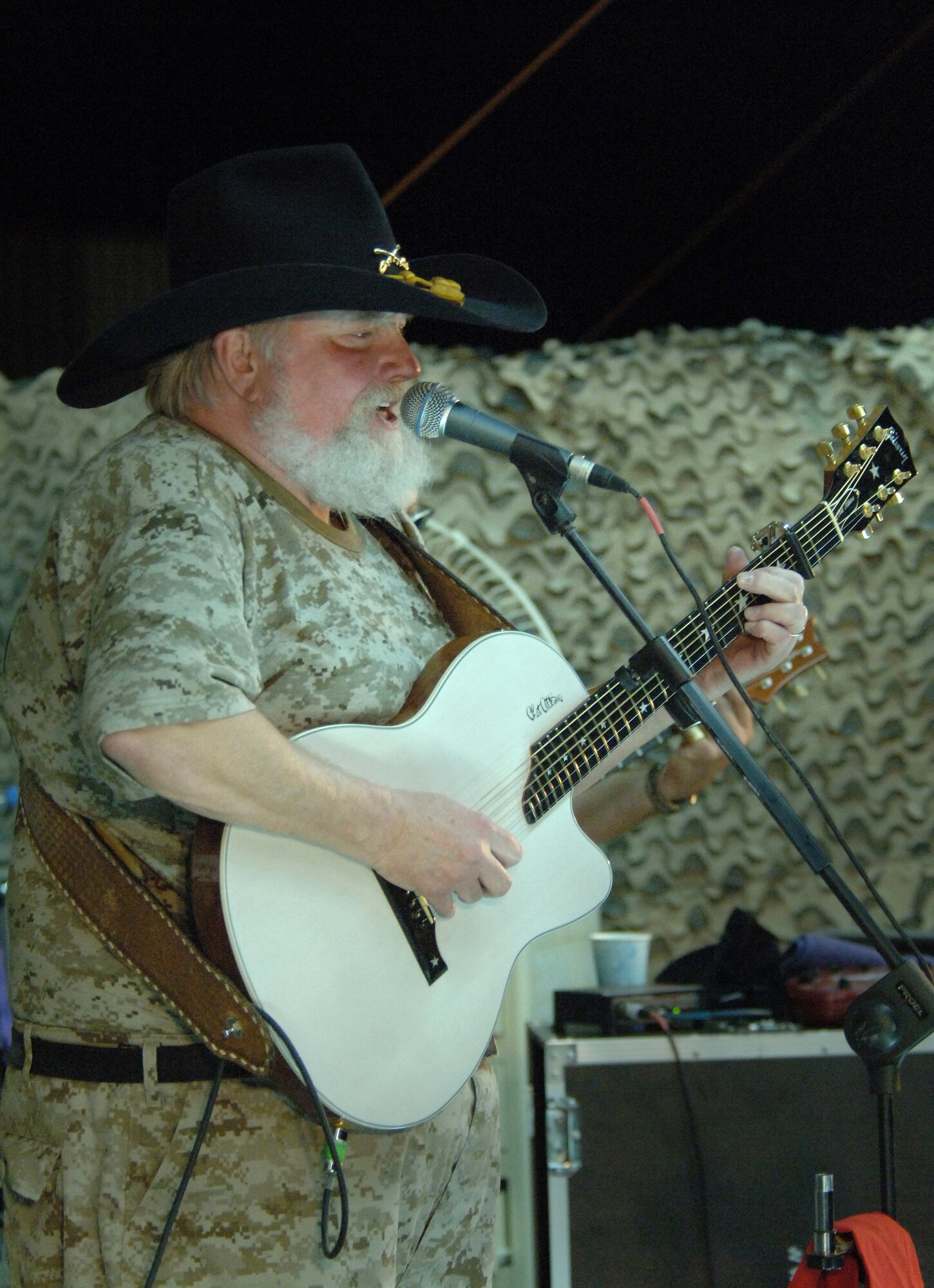 The Charlie Daniels Band plays for servicemembers at Ali Base, Iraq, on Saturday, April 15, 2006, as part of Stars for Stripes, a nonprofit organization which works with Armed Forces Entertainment and U.S. Army Europe Morale, Welfare and Recreation to bring celebrity entertainment to remote sites. The Charlie Daniels Band has been entertaining U.S. military troops around the world for more than 35 years. (U.S. Air Force photo/Staff Sgt. Valerie Smith)