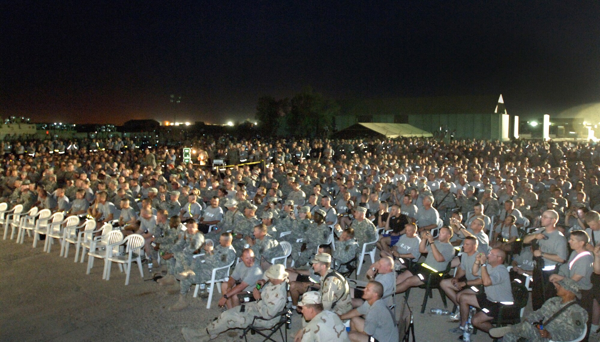Servicemembers at Ali Base, Iraq, await the start of the Charlie Daniels Band concert on Saturday, April 15, 2006. The performance was presented as part of Stars for Stripes, a nonprofit organization which works with Armed Forces Entertainment and U.S. Army Europe Morale, Welfare and Recreation to bring celebrity entertainment to remote sites. The Charlie Daniels Band has been entertaining U.S. military troops around the world for more than 35 years. (U.S. Air Force photo/Staff Sgt. Valerie Smith)