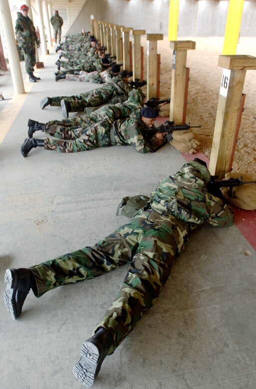 Team Langley members train on the M-9 Beretta handgun and the M-4 assault rifle at the Combat Arms Training and Maintenance (CATM) course on Dec. 14, 2005 at Langley Air Force Base, Virginia. (U.S. Air Force photo by Staff Sgt. Verlin Levi Collins)